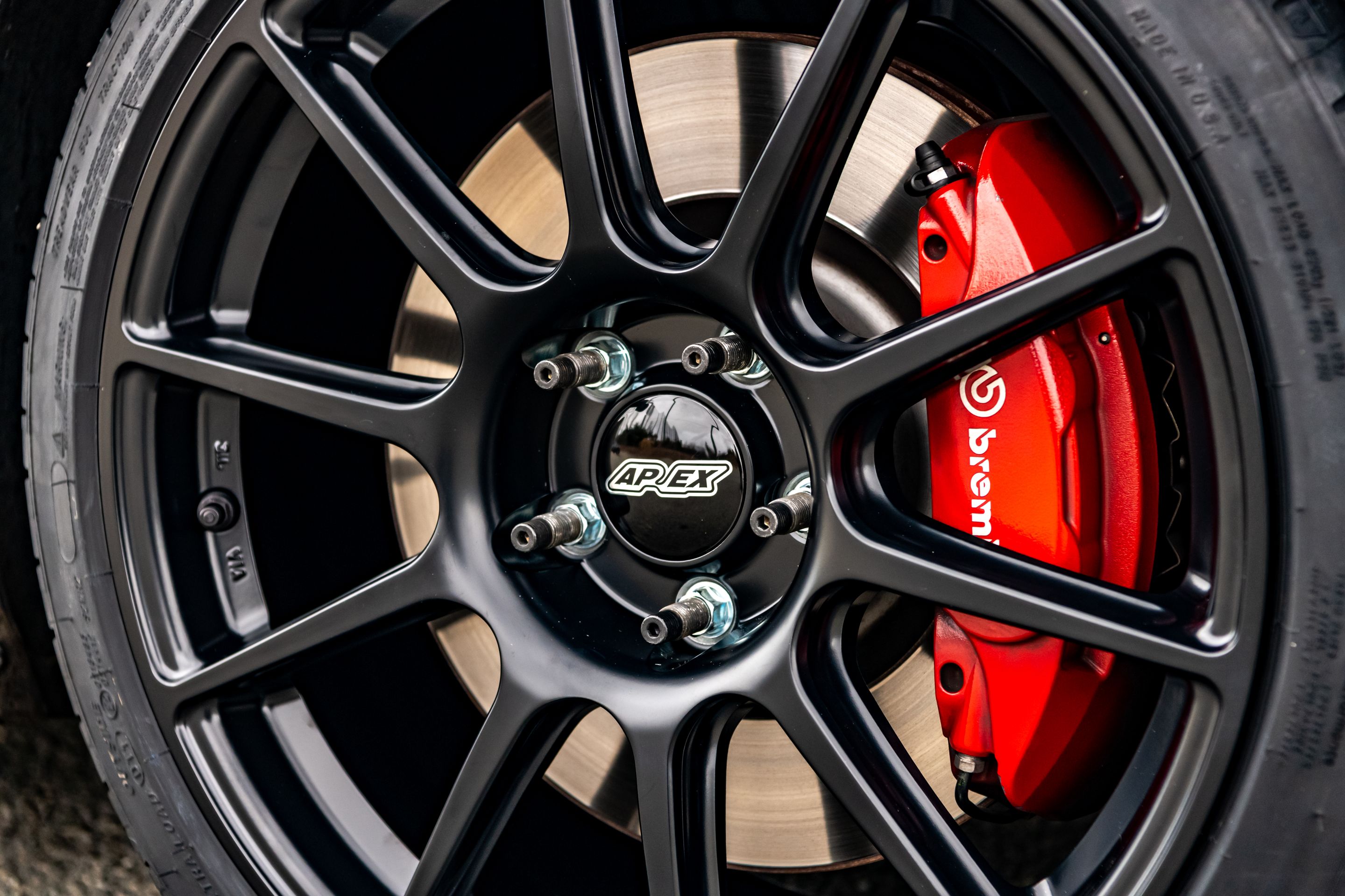 Blue VW MK7 GTI with 18" SM-10 Apex wheels in Satin Black