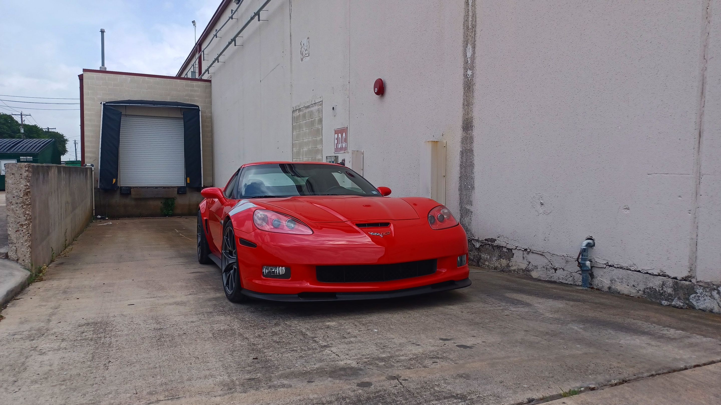 Red Chevrolet C6 Corvette Grand Sport with 19" VS-5RS Apex wheels in Anthracite