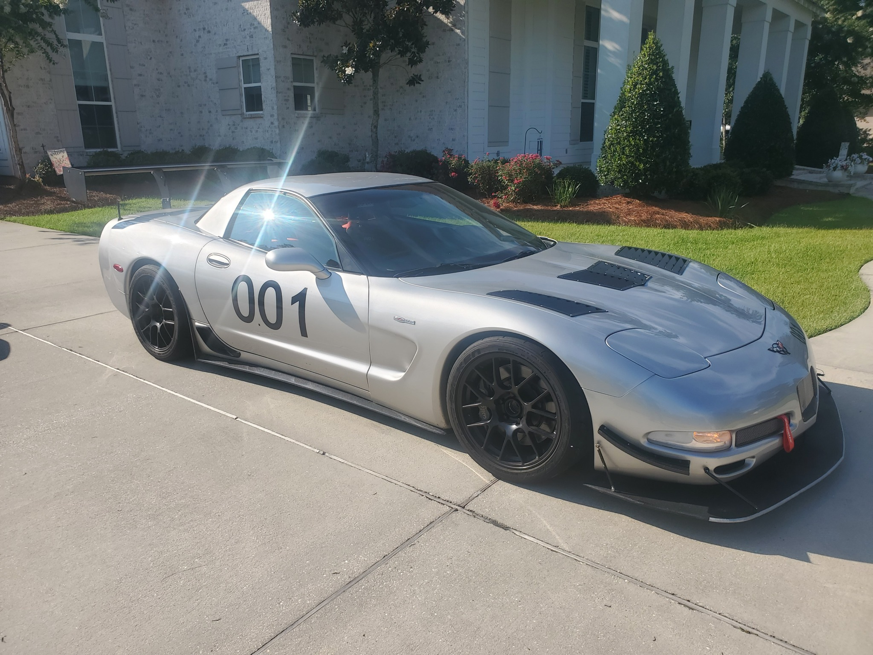 Silver Chevrolet C5 Corvette Z06 with 18" EC-7 Apex wheels in Satin Black