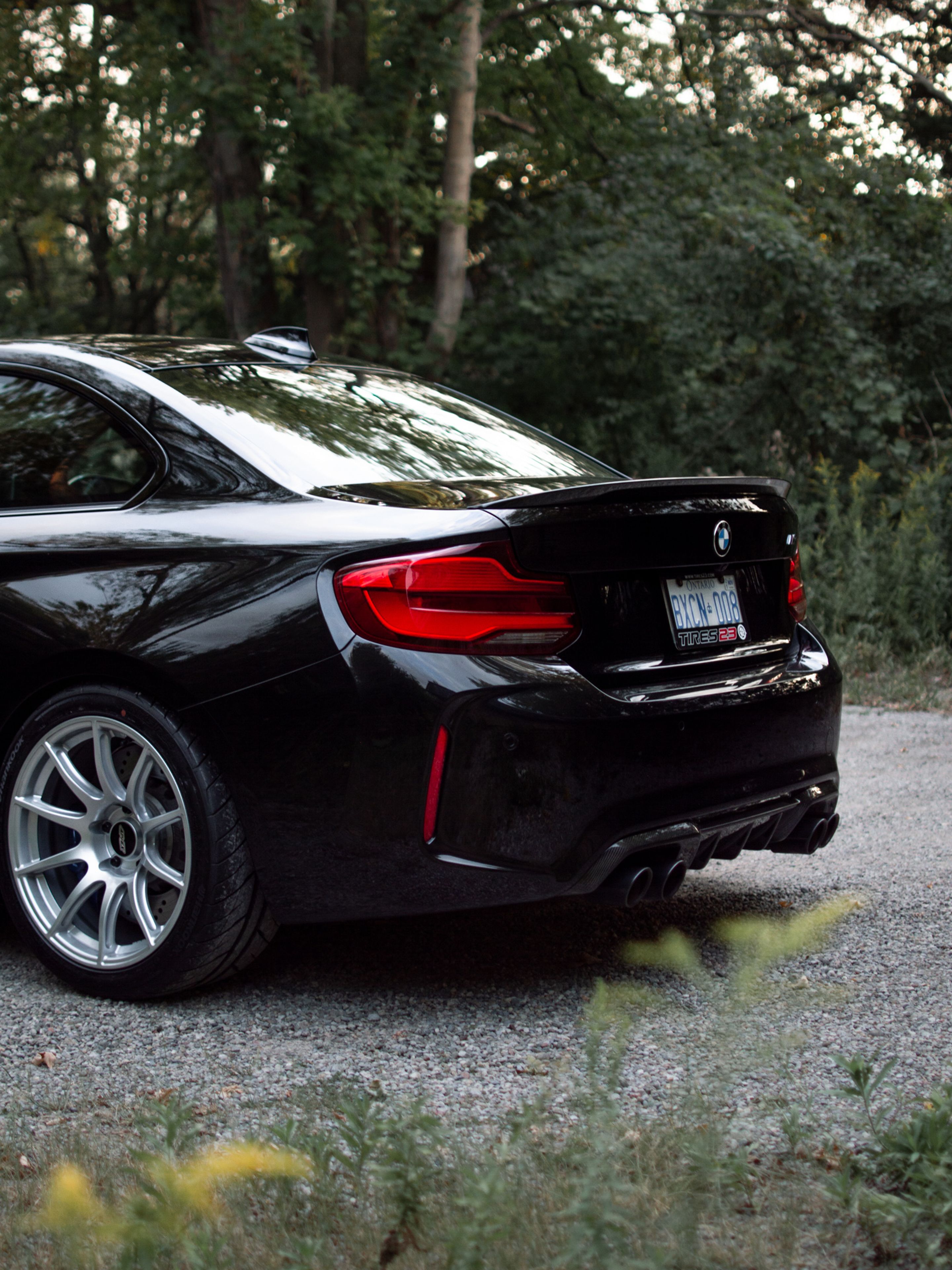 Black BMW F87 M2 with 18" SM-10 Apex wheels in Race Silver