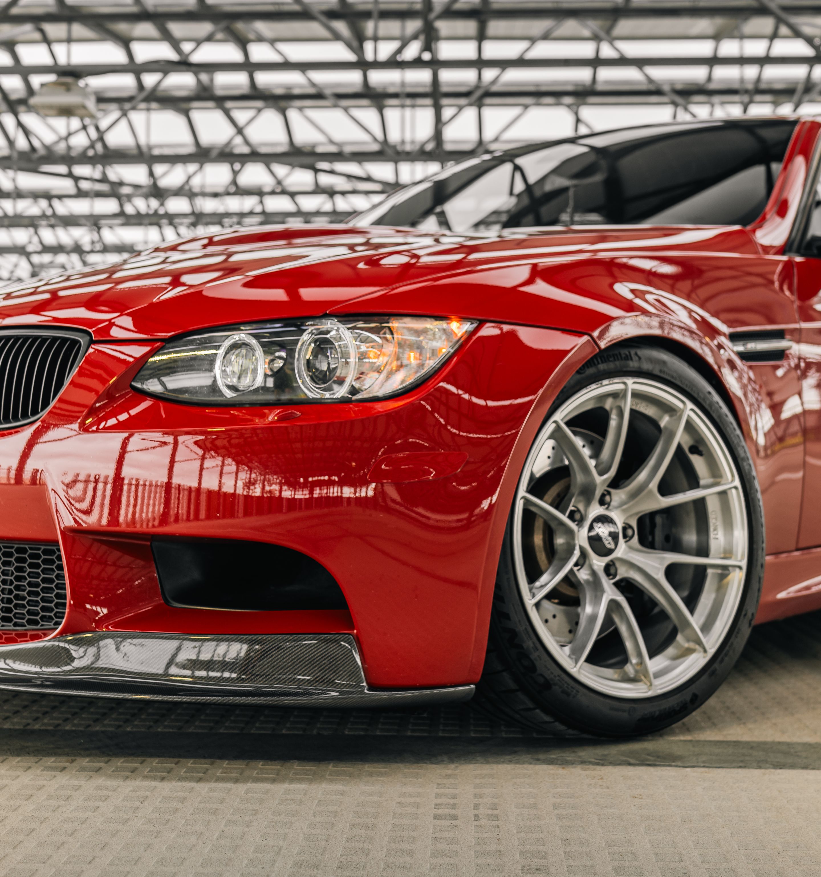 Red BMW E90 Sedan M3 with 18" VS-5RS Apex wheels in Brushed Clear