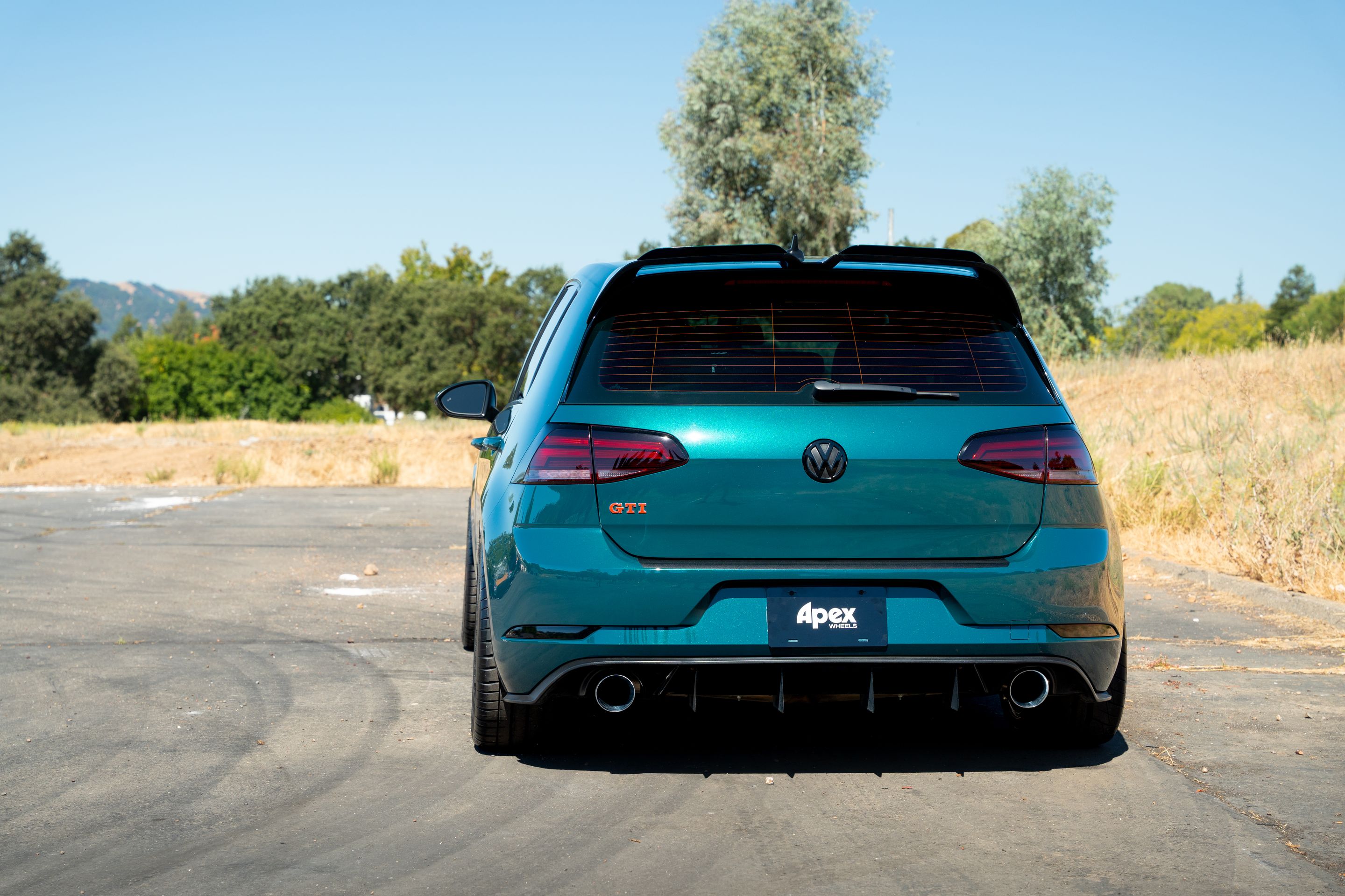 Green VW MK7 GTI with 18" ML-10RT Apex wheels in Machined Lip Gloss Motorsport Gold