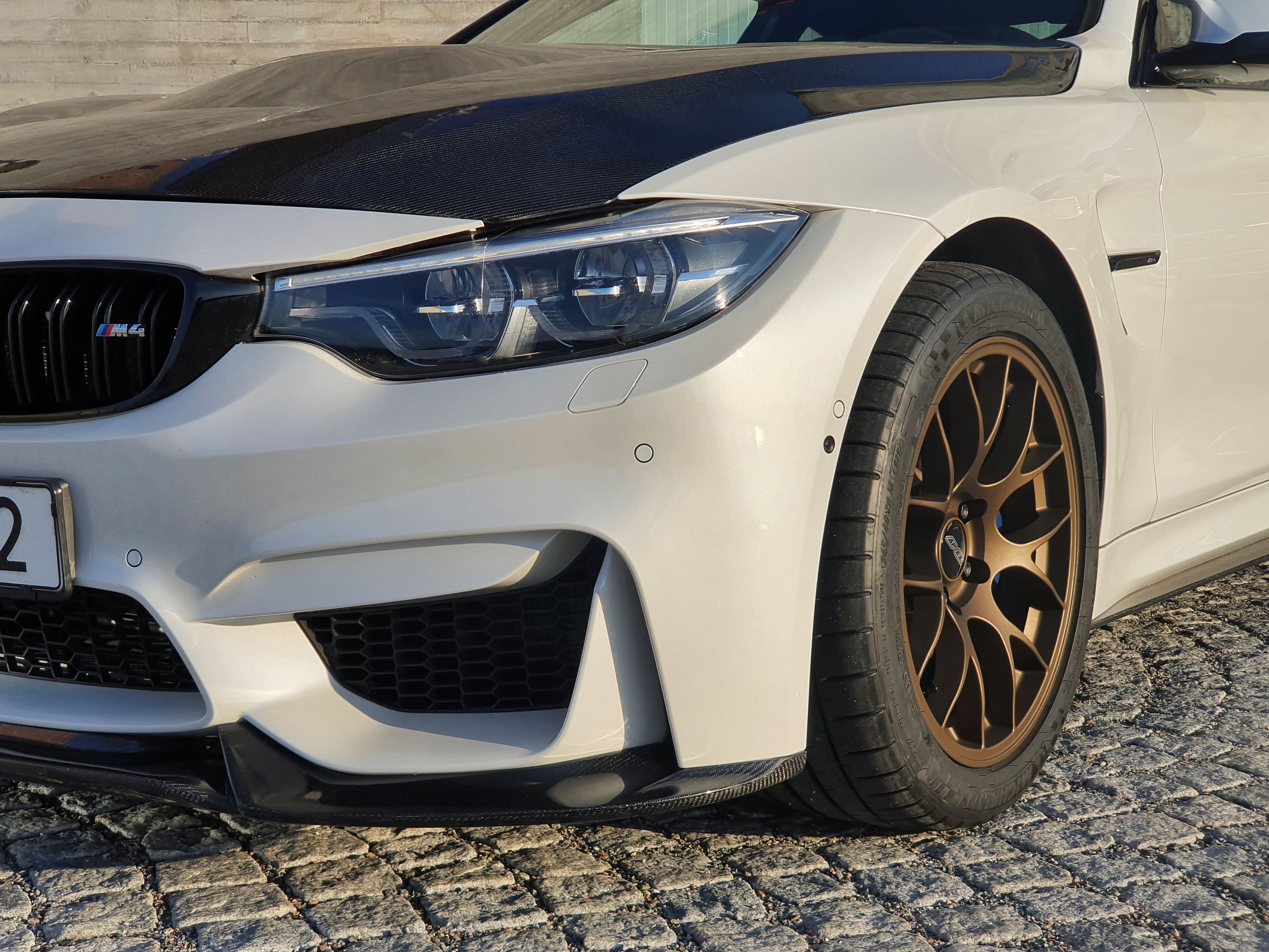 White BMW F82 Coupe M4 with 18" EC-7 Apex wheels in Satin Bronze