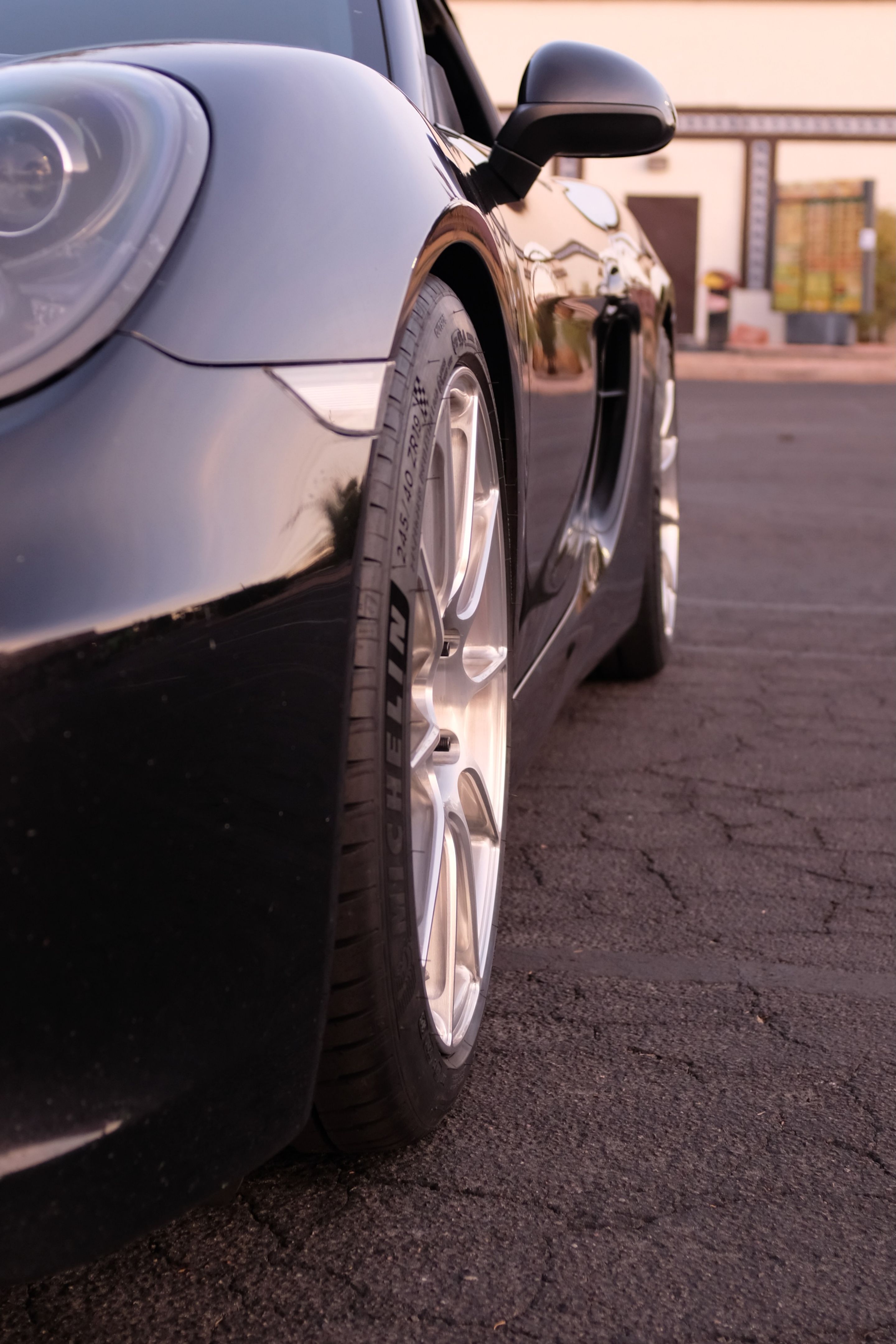 Black Porsche 981 Cayman S with 19" SM-10RS Apex wheels in Brushed Clear