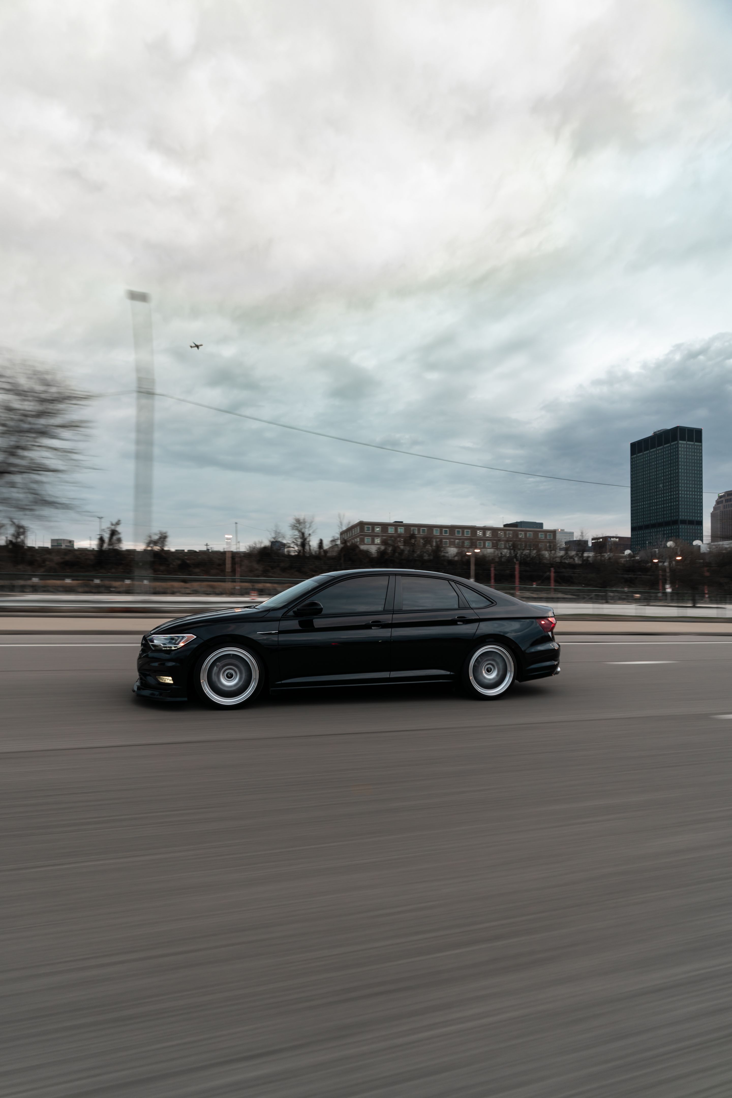 Black VW MK7 Jetta with 19" ML-10RT Apex wheels in Machined Lip Race Silver