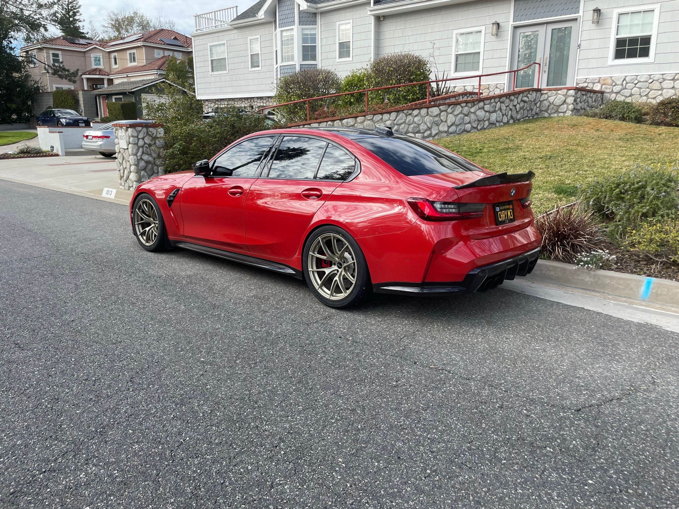 Red BMW G80 M3 with 19" VS-5RS Apex wheels in Motorsport Gold