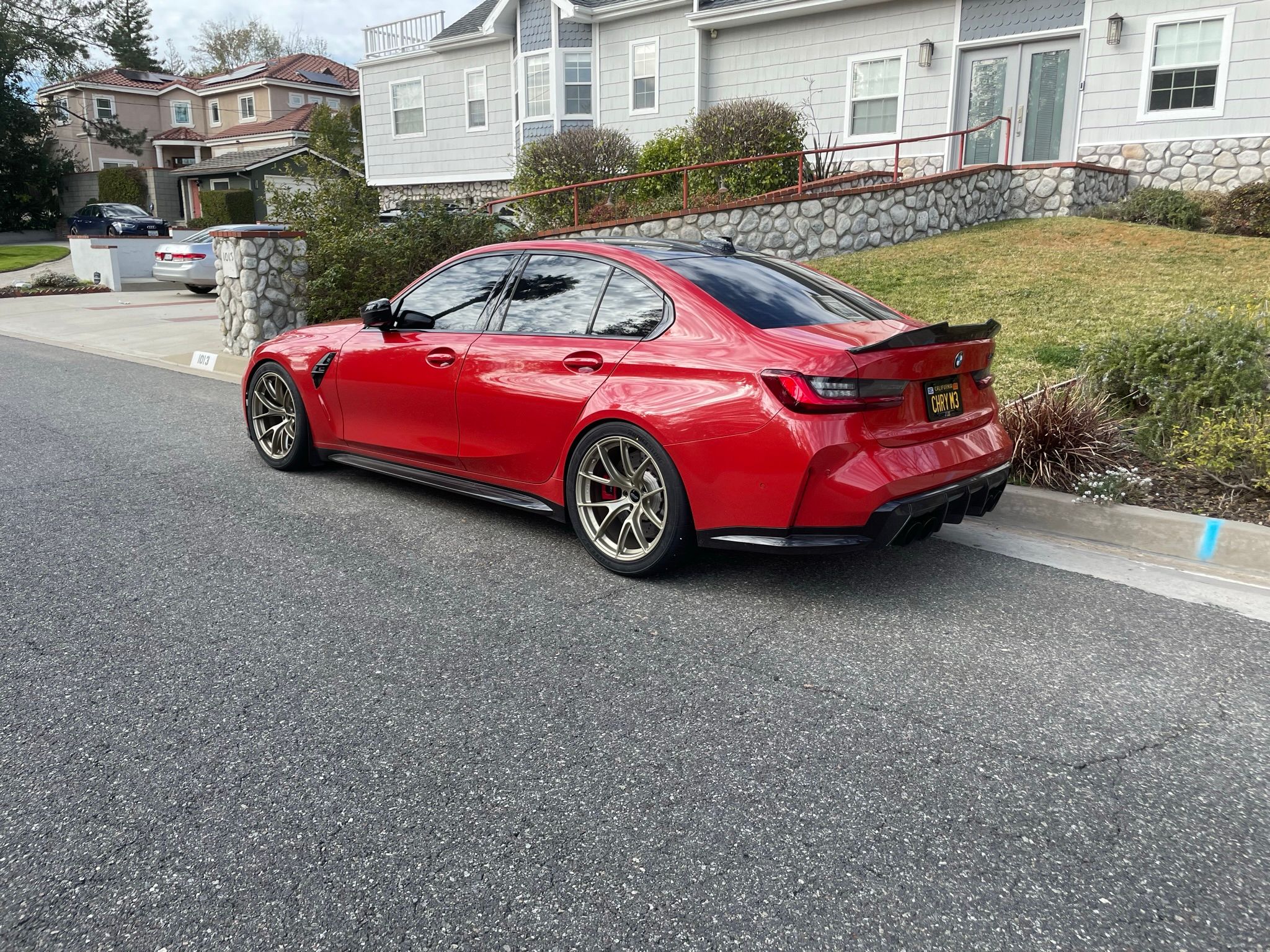 Red BMW G80 M3 with 19" VS-5RS Apex wheels in Motorsport Gold