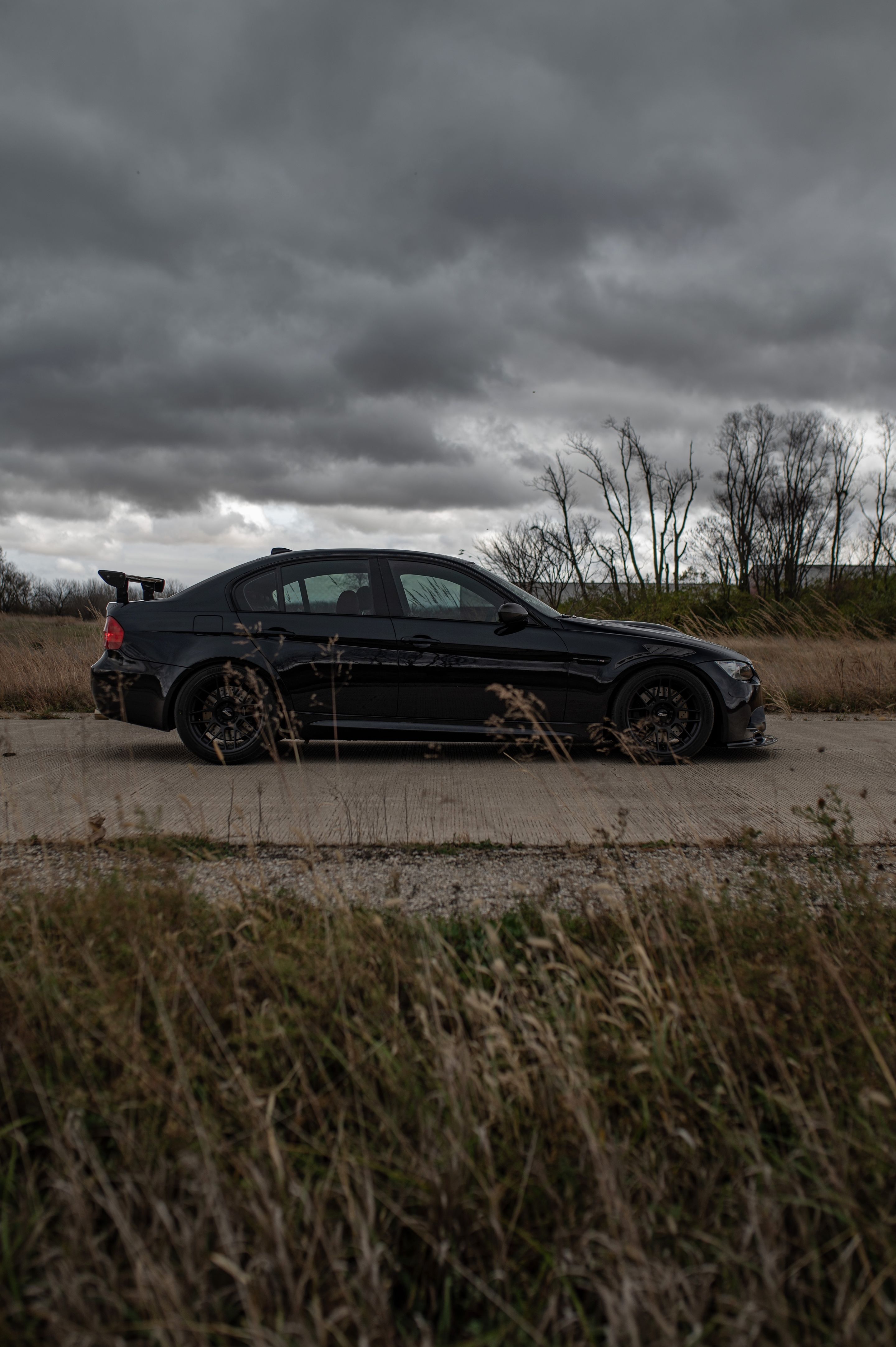 Black BMW E90 Sedan M3 with 18" ARC-8 Apex wheels in Satin Black