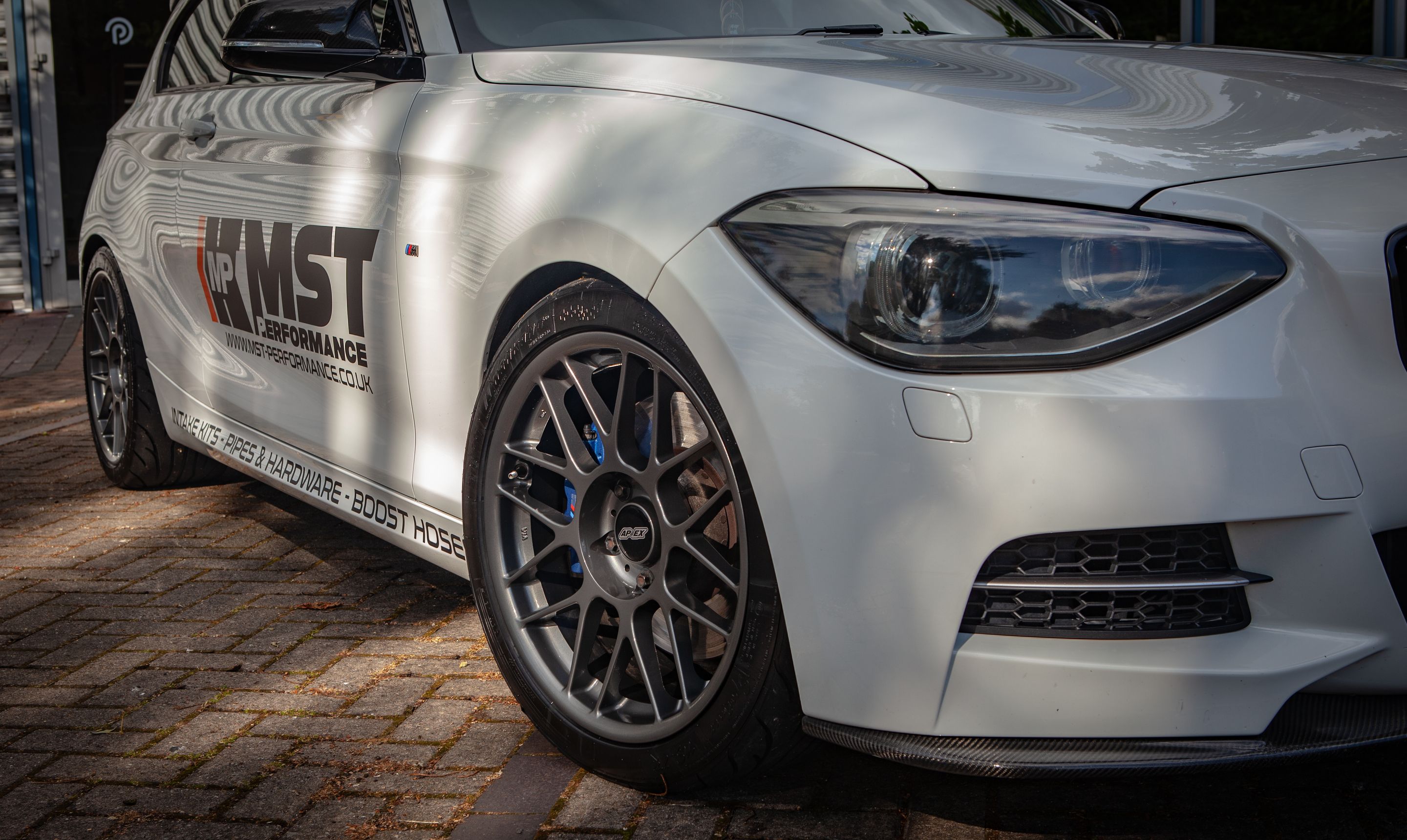 White BMW F21 3 Door Hatchback 1 Series with 18" ARC-8 Apex wheels in Anthracite