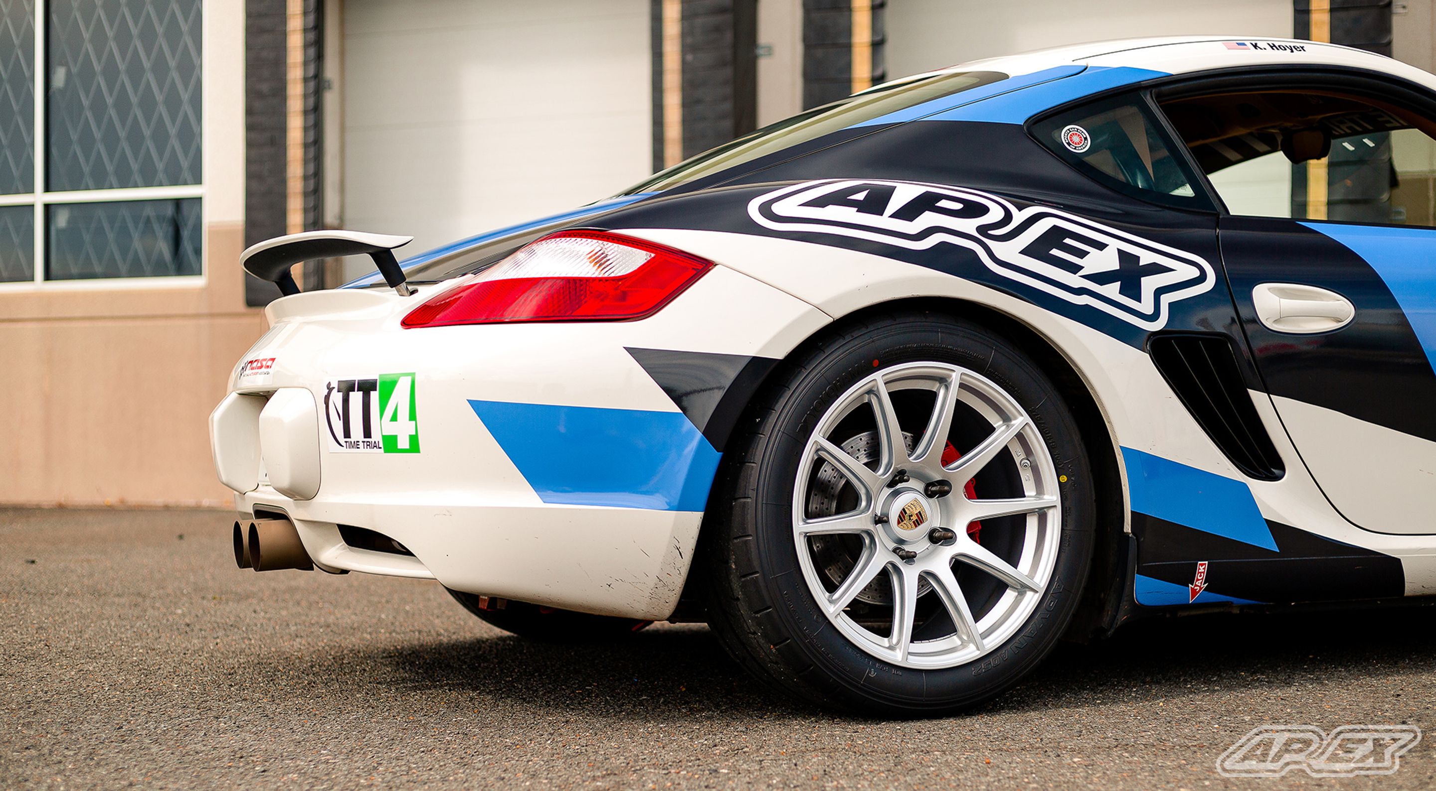White Porsche 987 Cayman S with 18" SM-10 Apex wheels in Race Silver