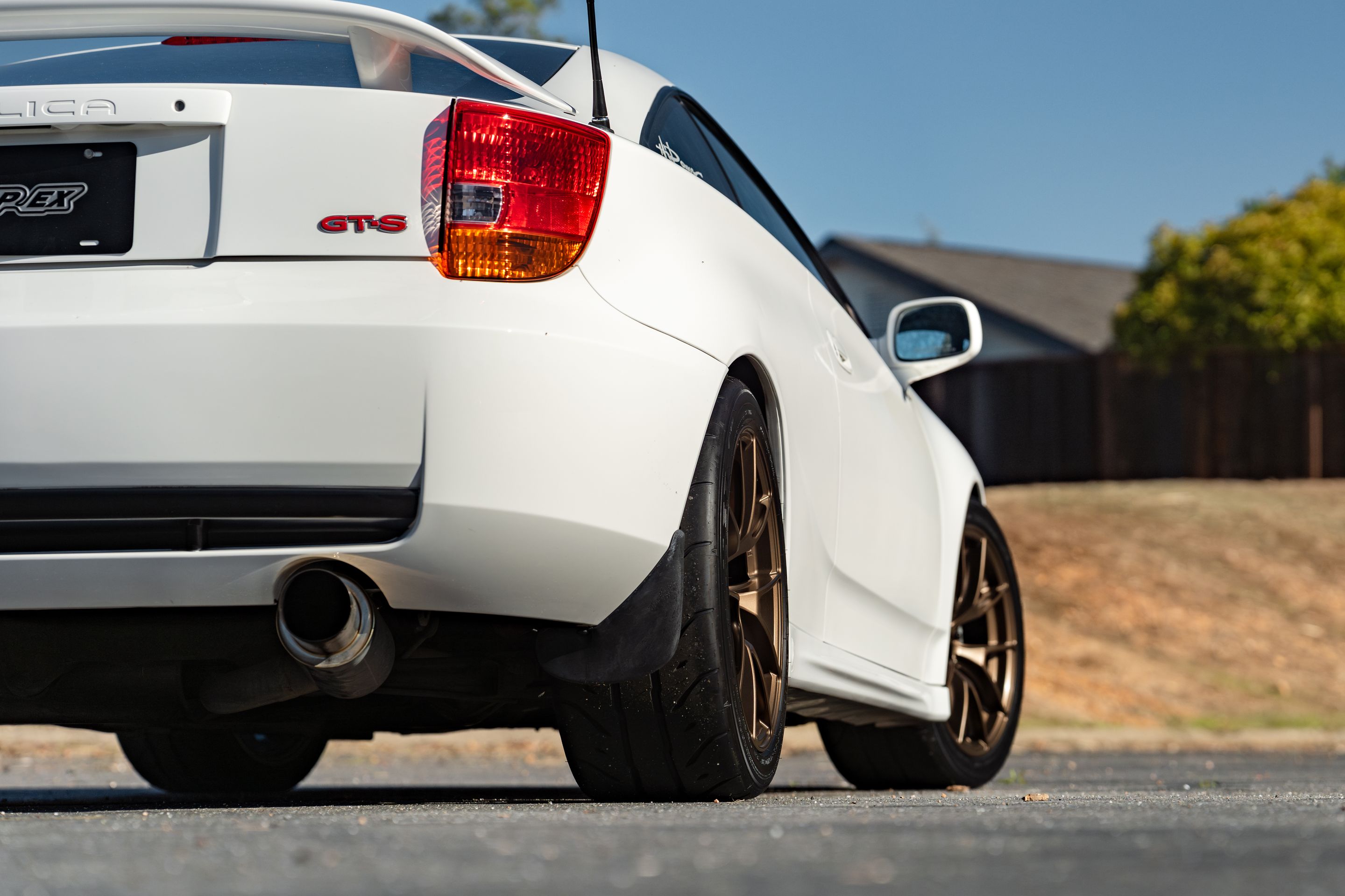 White Toyota 7th Gen Celica with 17" VS-5RS Apex wheels in Satin Bronze