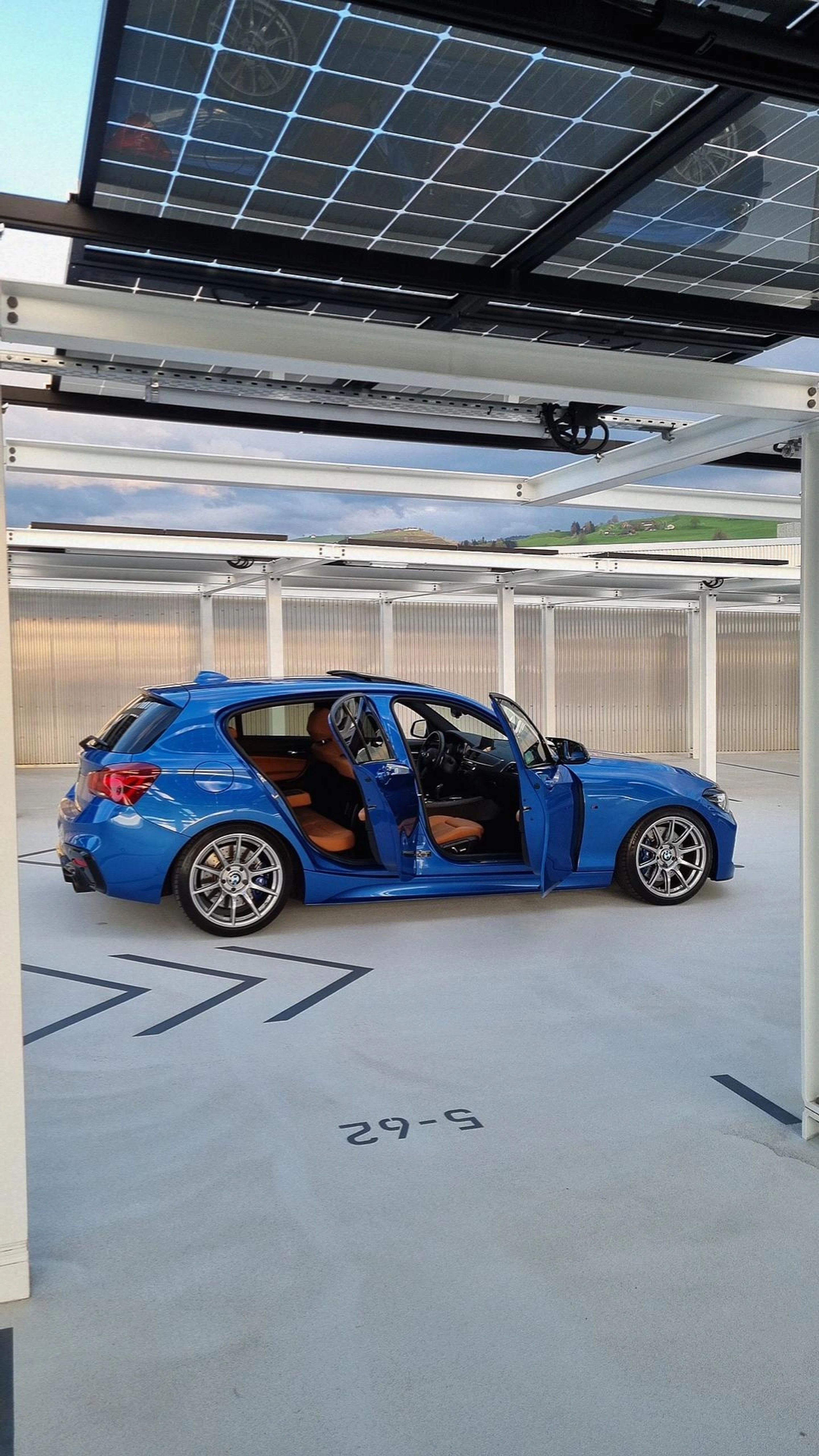 Blue BMW F20 Hatchback 1 Series with 18" SM-10 Apex wheels in Custom Finish