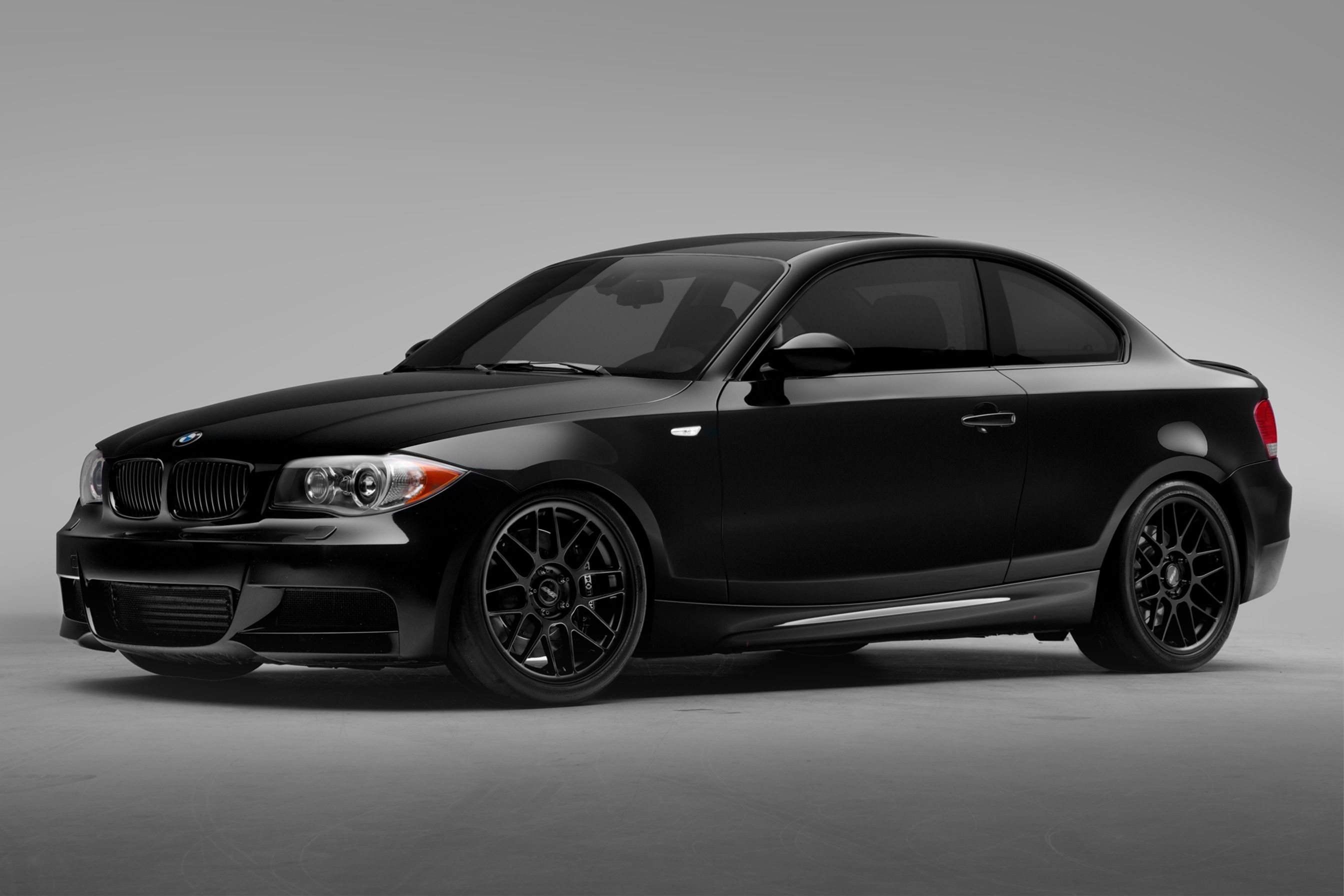 Black BMW E82 Coupe 1 Series with 18" ARC-8 Apex wheels in Satin Black