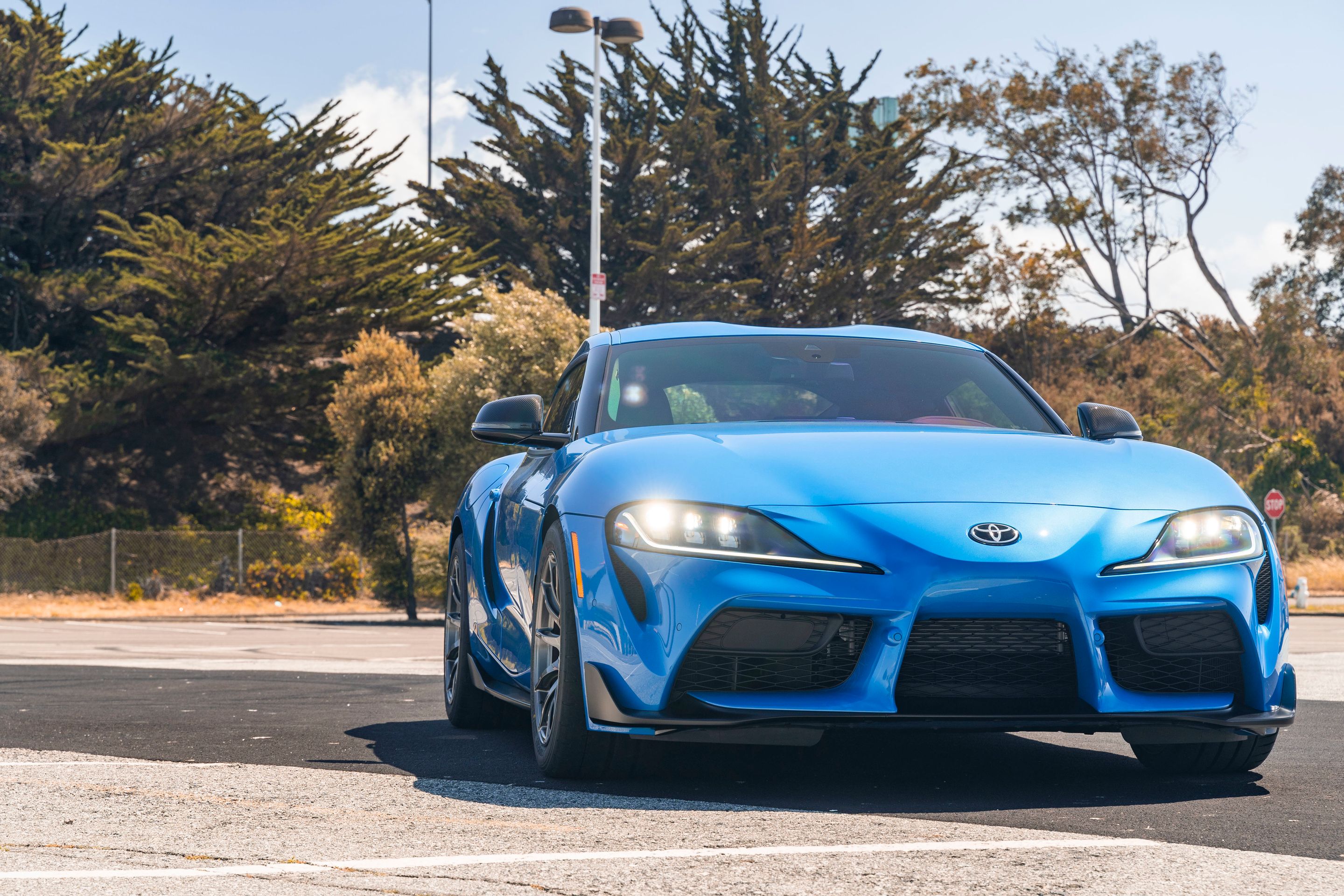 Blue Toyota GR Supra with 18" SM-10 Apex wheels in Anthracite