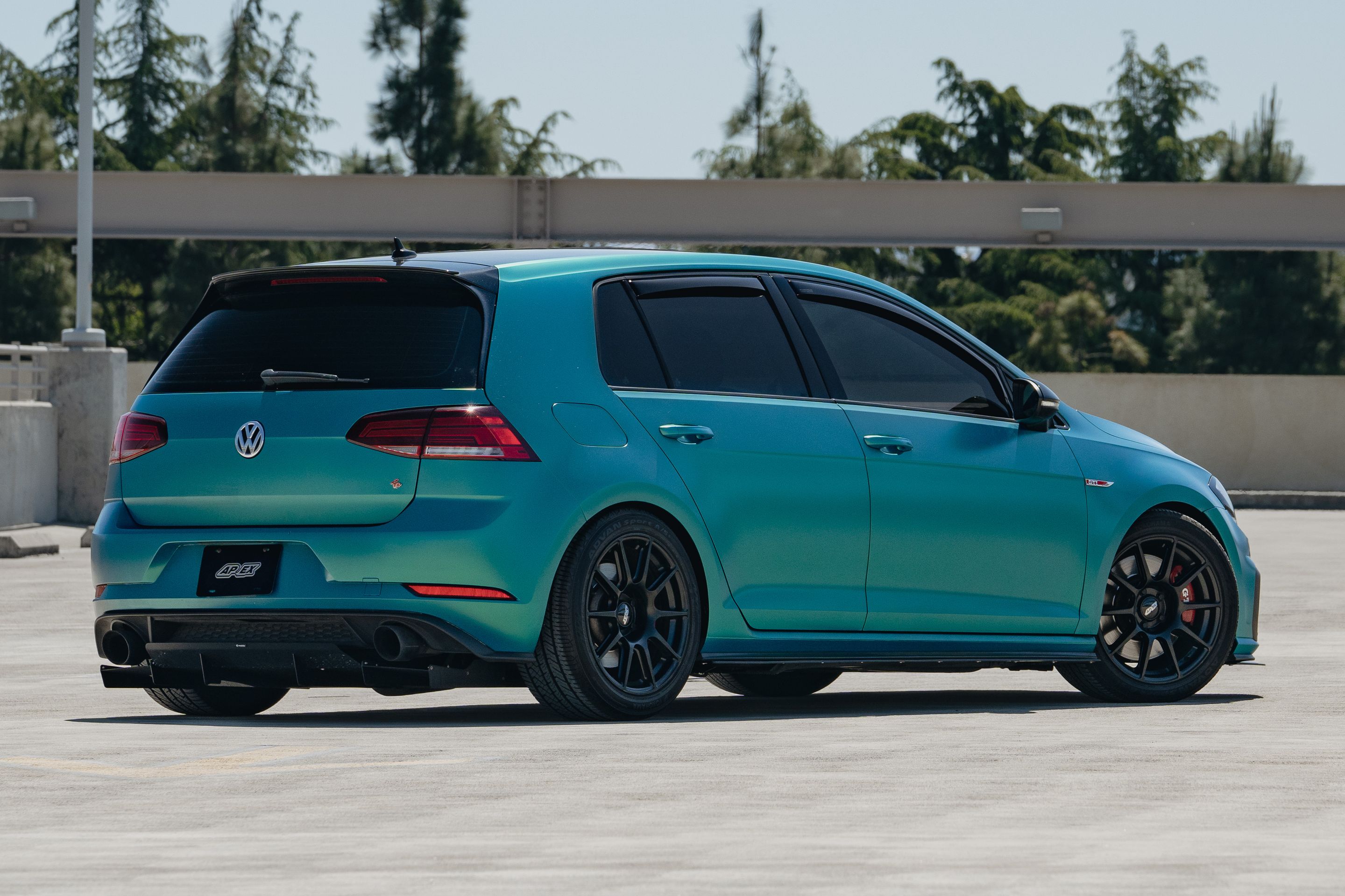 Green VW MK7 GTI with 17" SM-10 Apex wheels in Satin Black
