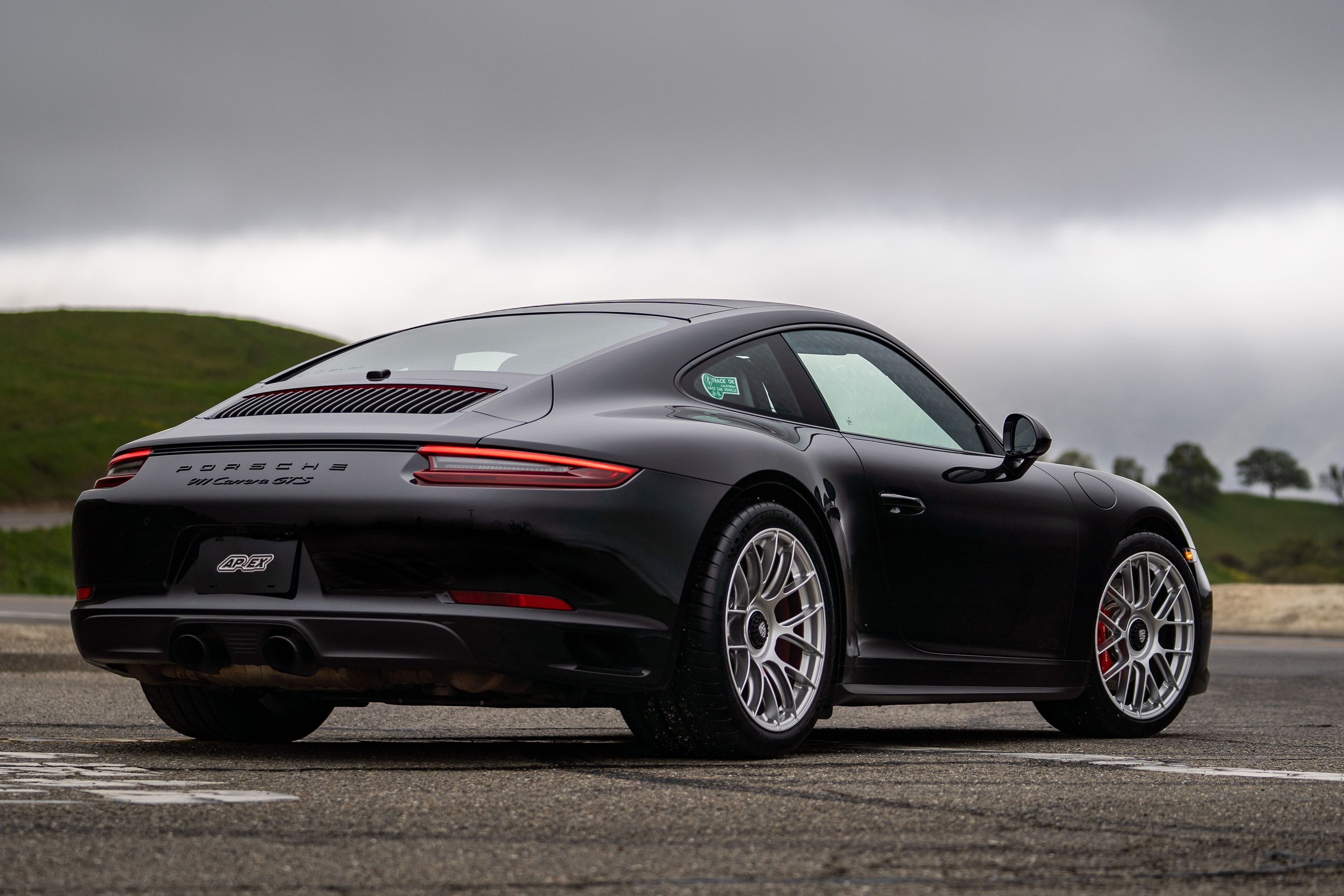 Black Porsche 911 991.2 Carrera GTS with 19" EC-7RS Apex wheels in Race Silver