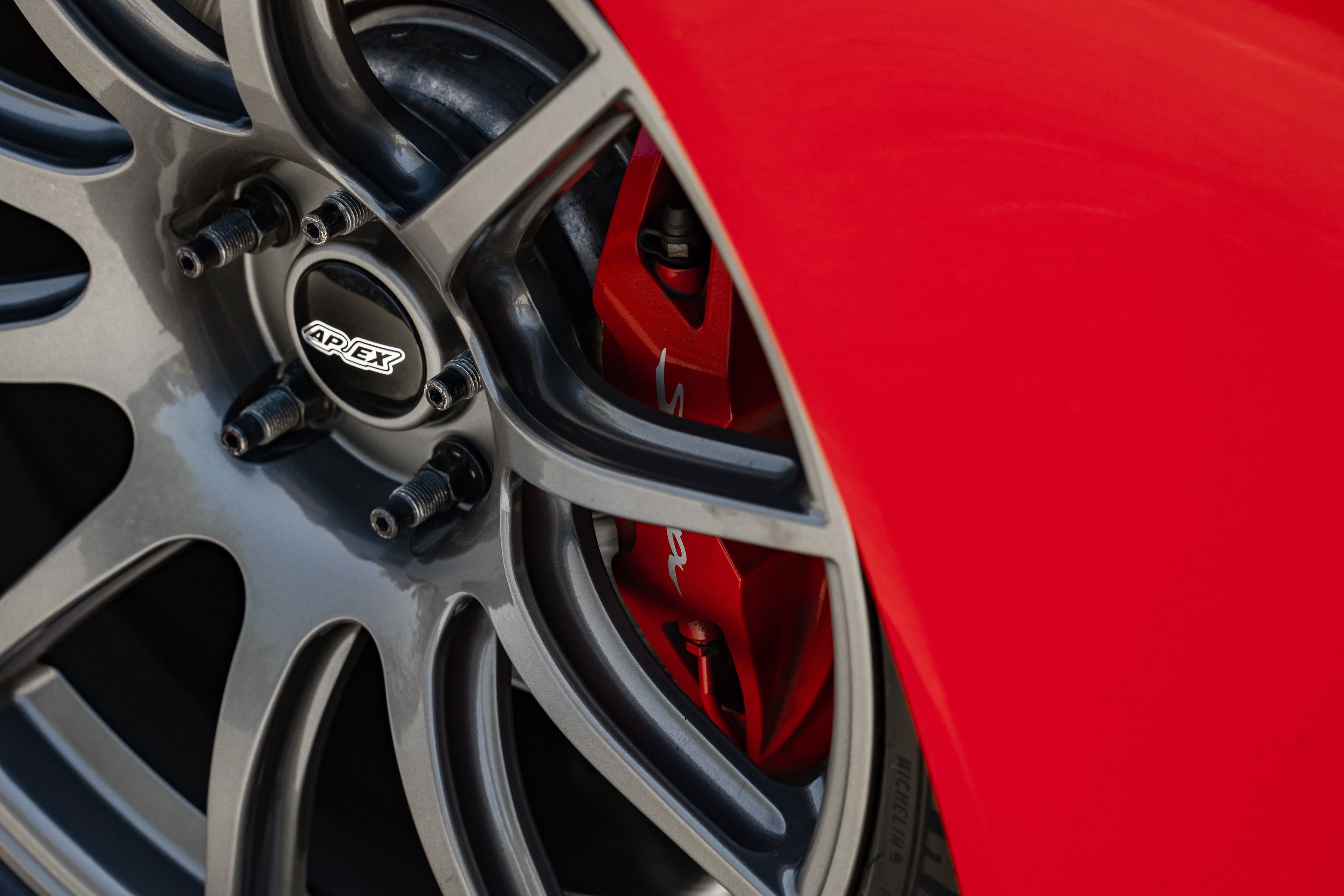 Red Toyota GR Supra with 19" SM-10 Apex wheels in Anthracite
