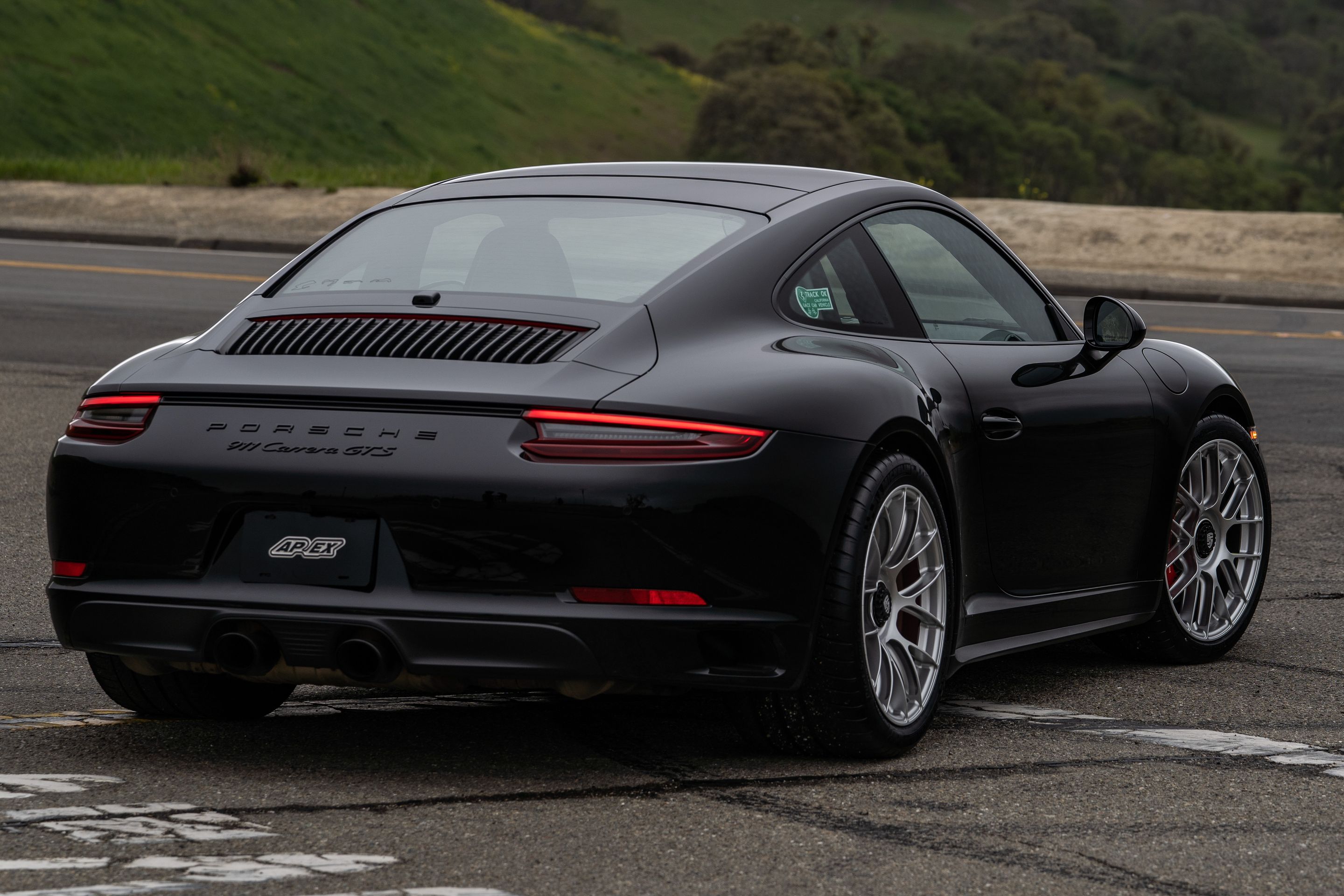 Black Porsche 911 991.2 Carrera GTS with 19" EC-7RS Apex wheels in Race Silver