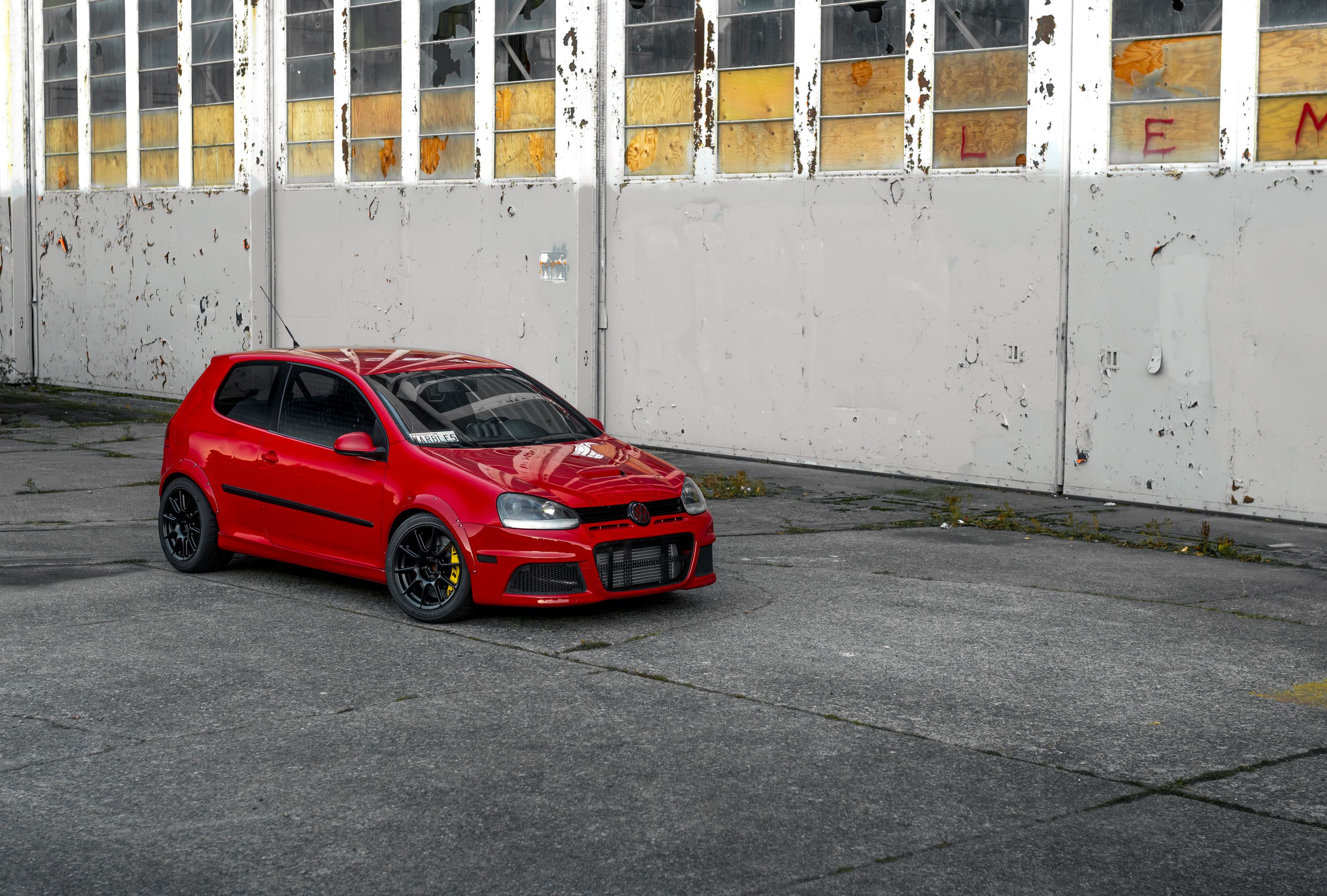 Red VW MK5 Golf with 17" SM-10 Apex wheels in Satin Black