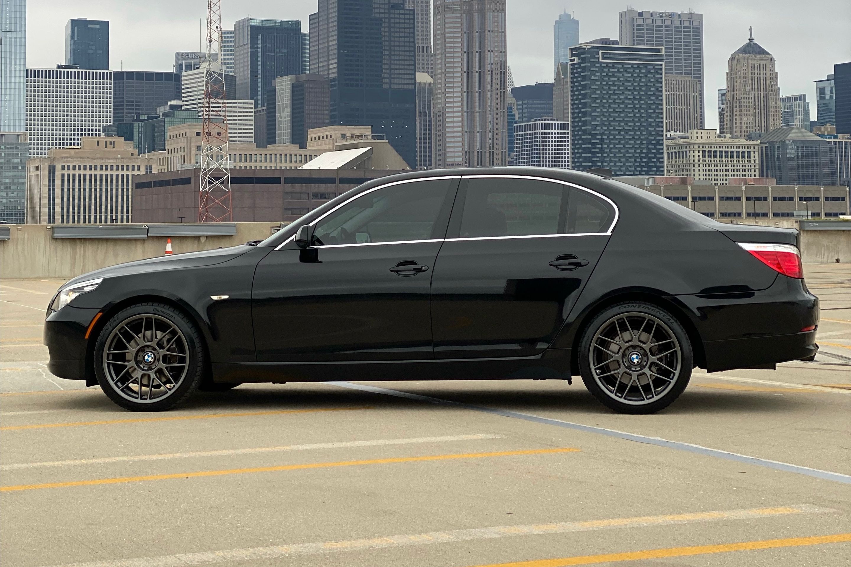 Black BMW E60 Sedan 5 Series with 19" ARC-8 Apex wheels in Anthracite