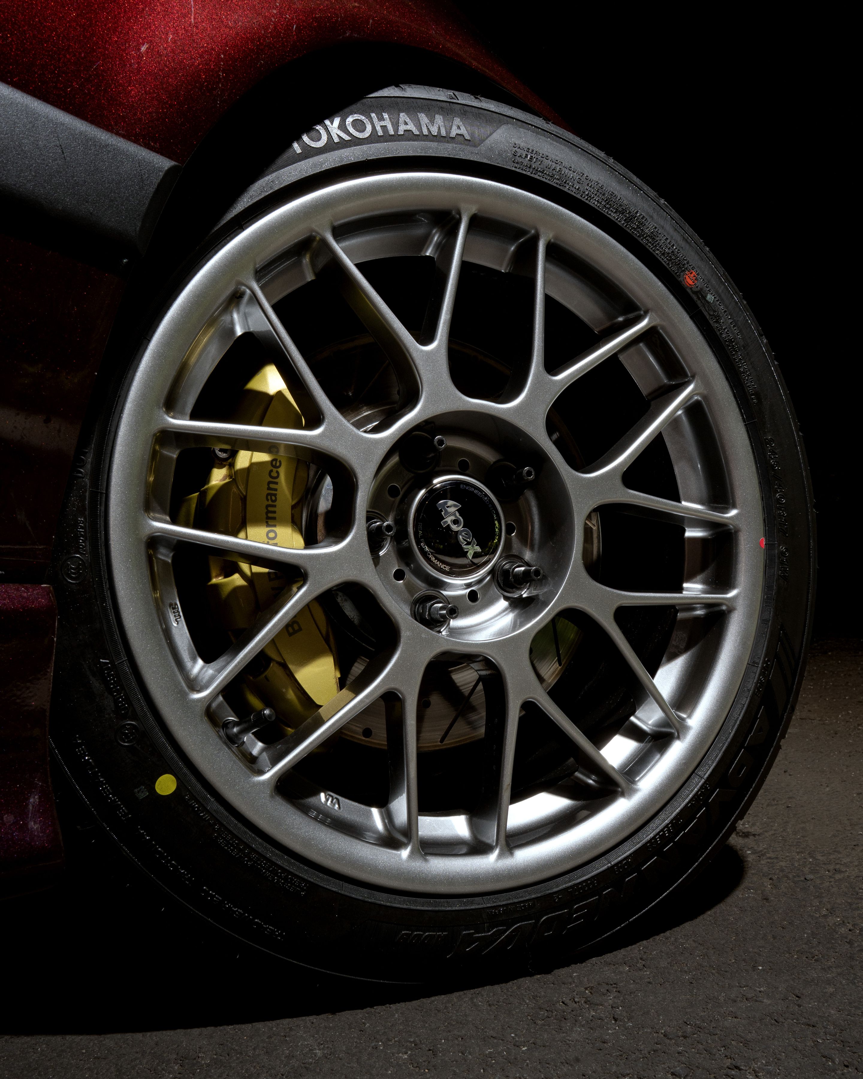 Red BMW E36 3 Series with 17" ARC-8 Apex wheels in Hyper Black