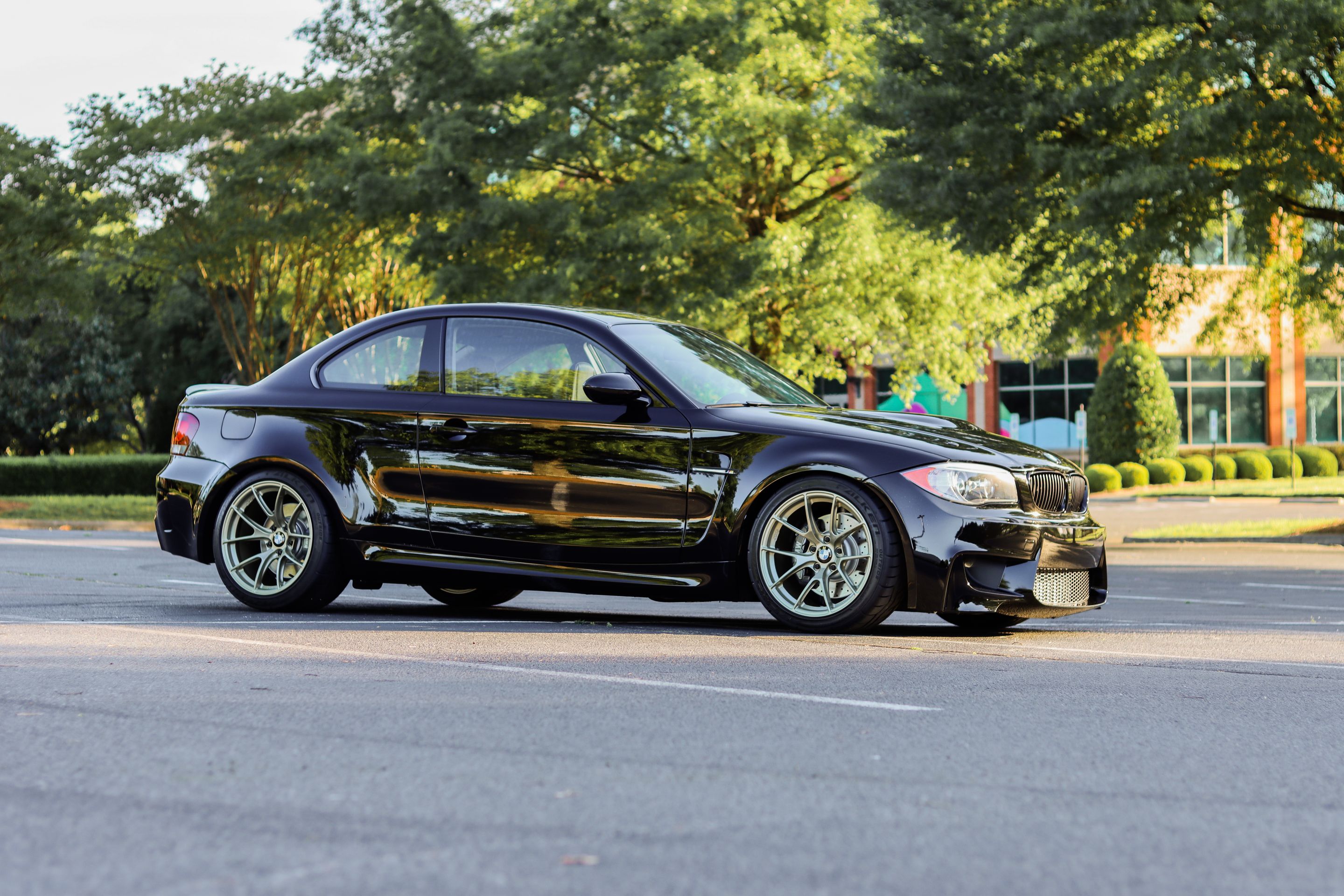 Black BMW E82 Coupe 1 Series with 18" VS-5RS Apex wheels in Motorsport Gold