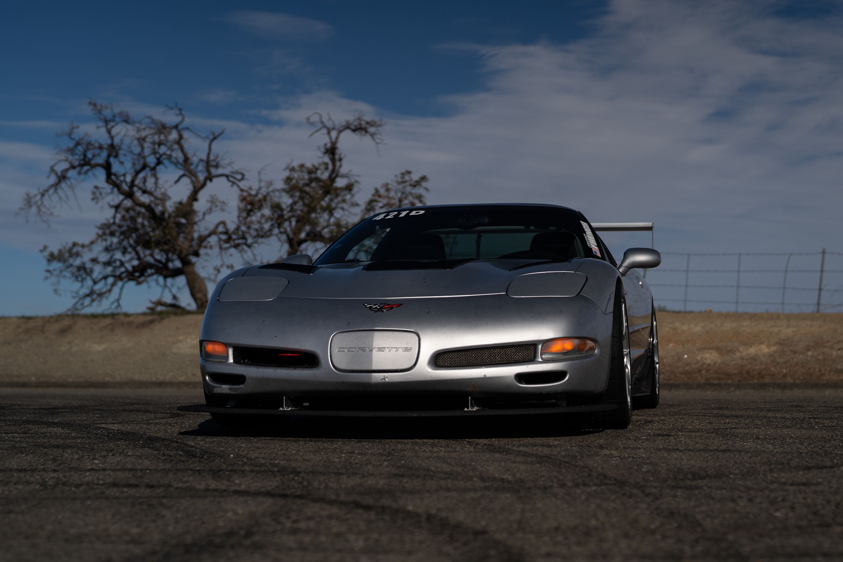 Silver Chevrolet C5 Corvette Z06 with 18" VS-5RS Apex wheels in Brushed Clear