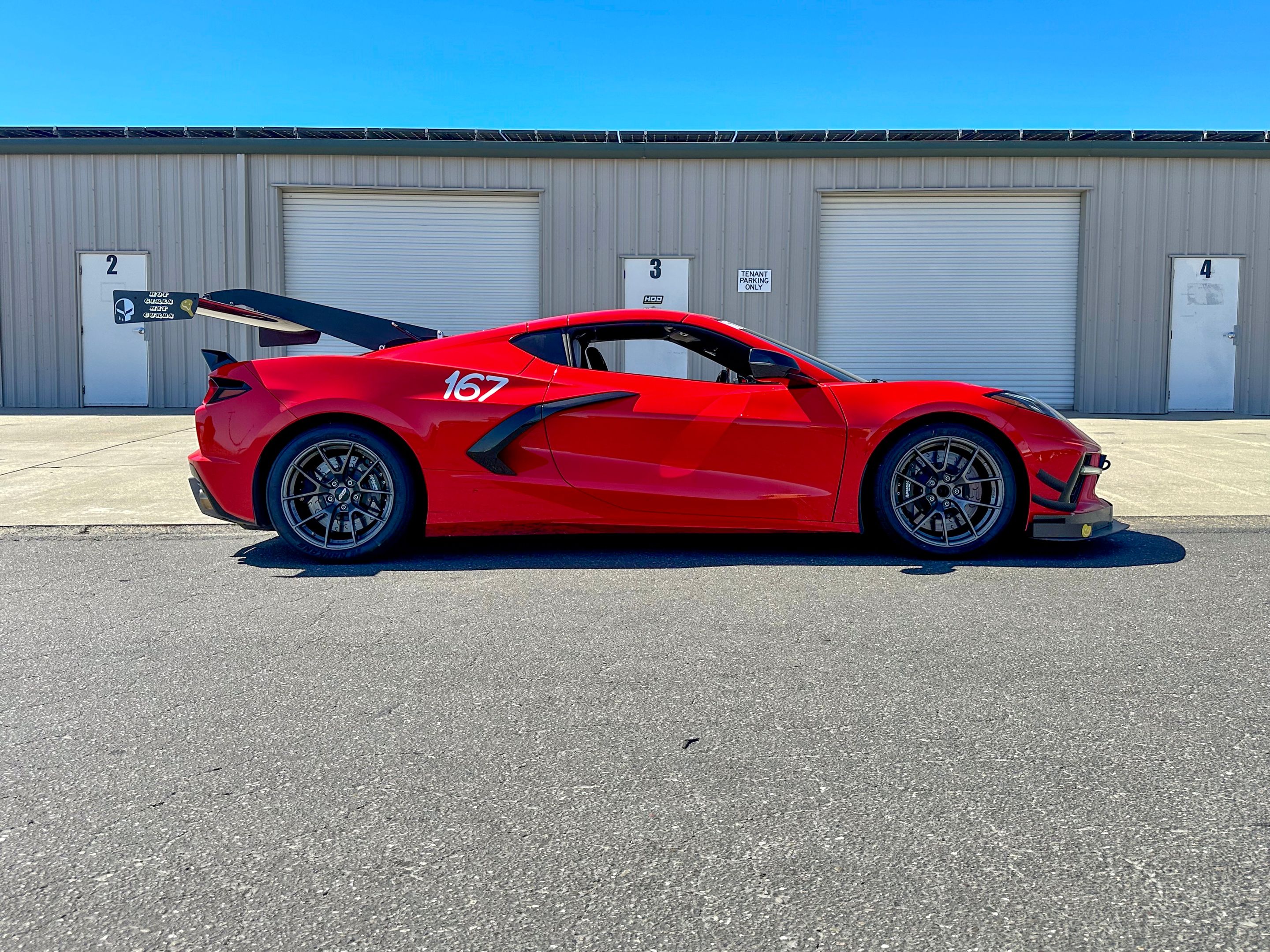 Red Chevrolet C8 Corvette Stingray/Z51 with 18"/19" VS-5RS Apex wheels in Anthracite