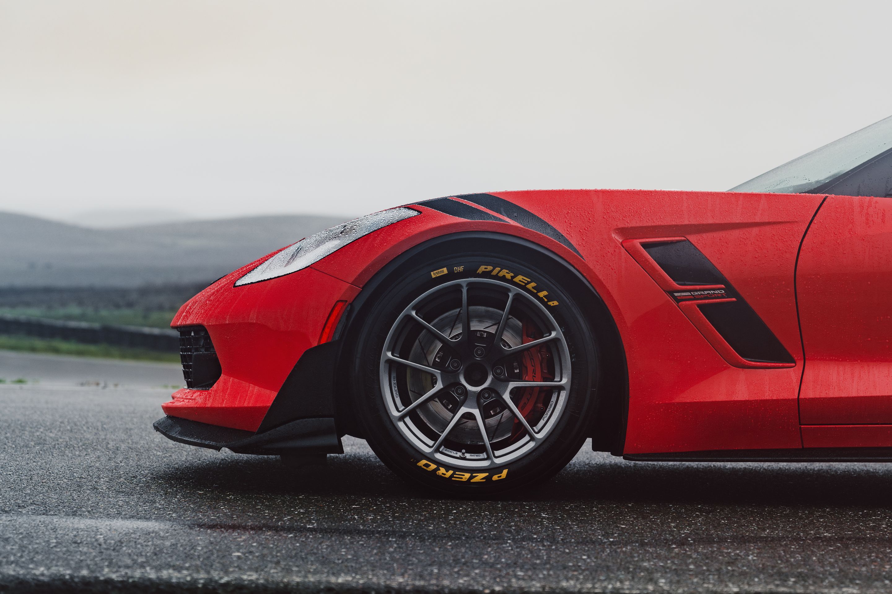 Red Chevrolet C7 Corvette Grand Sport with 18" VS-5RE Apex wheels in Anthracite