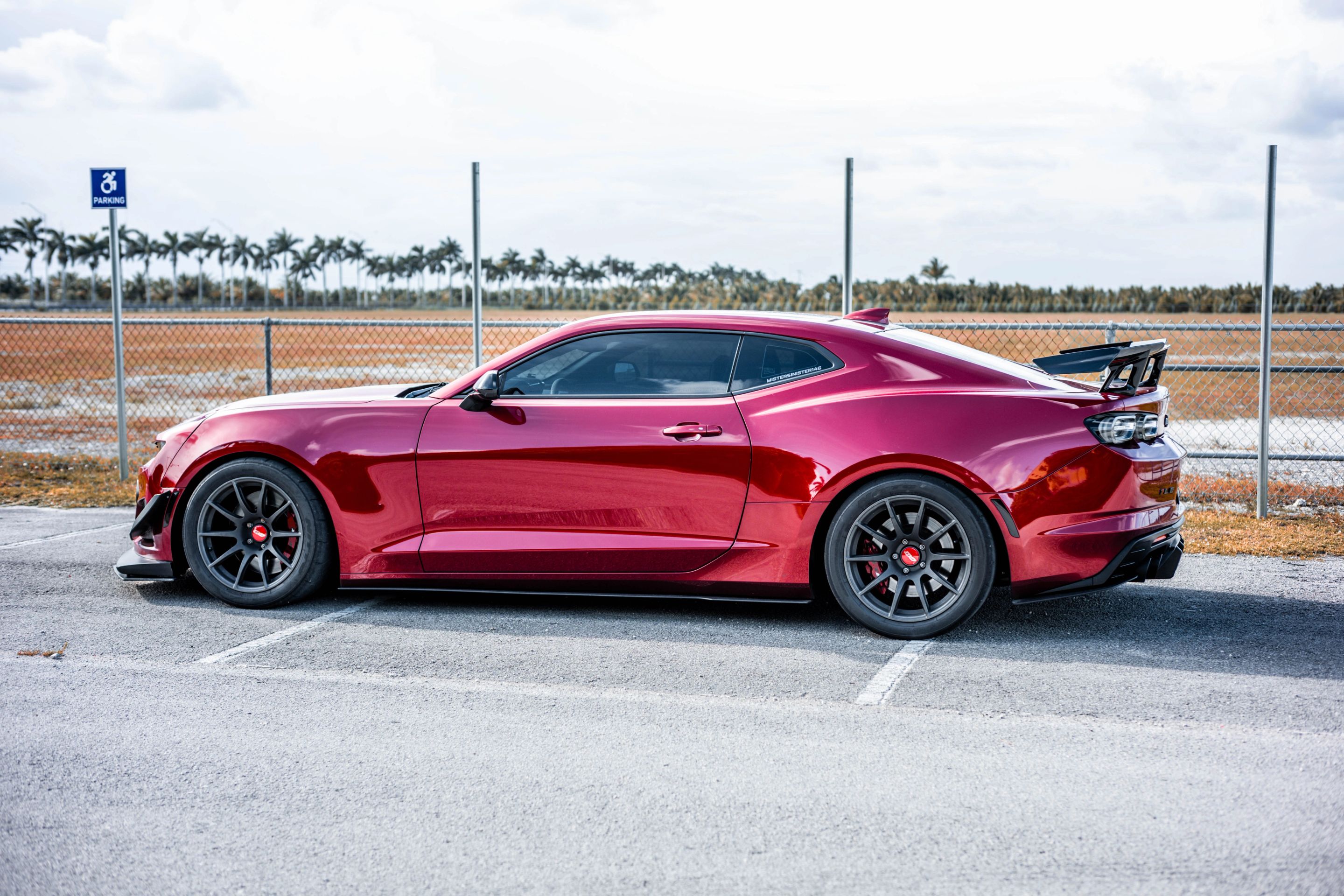 Red Chevrolet 6th Gen Camaro SS with 19" SM-10 Apex wheels in Satin Black