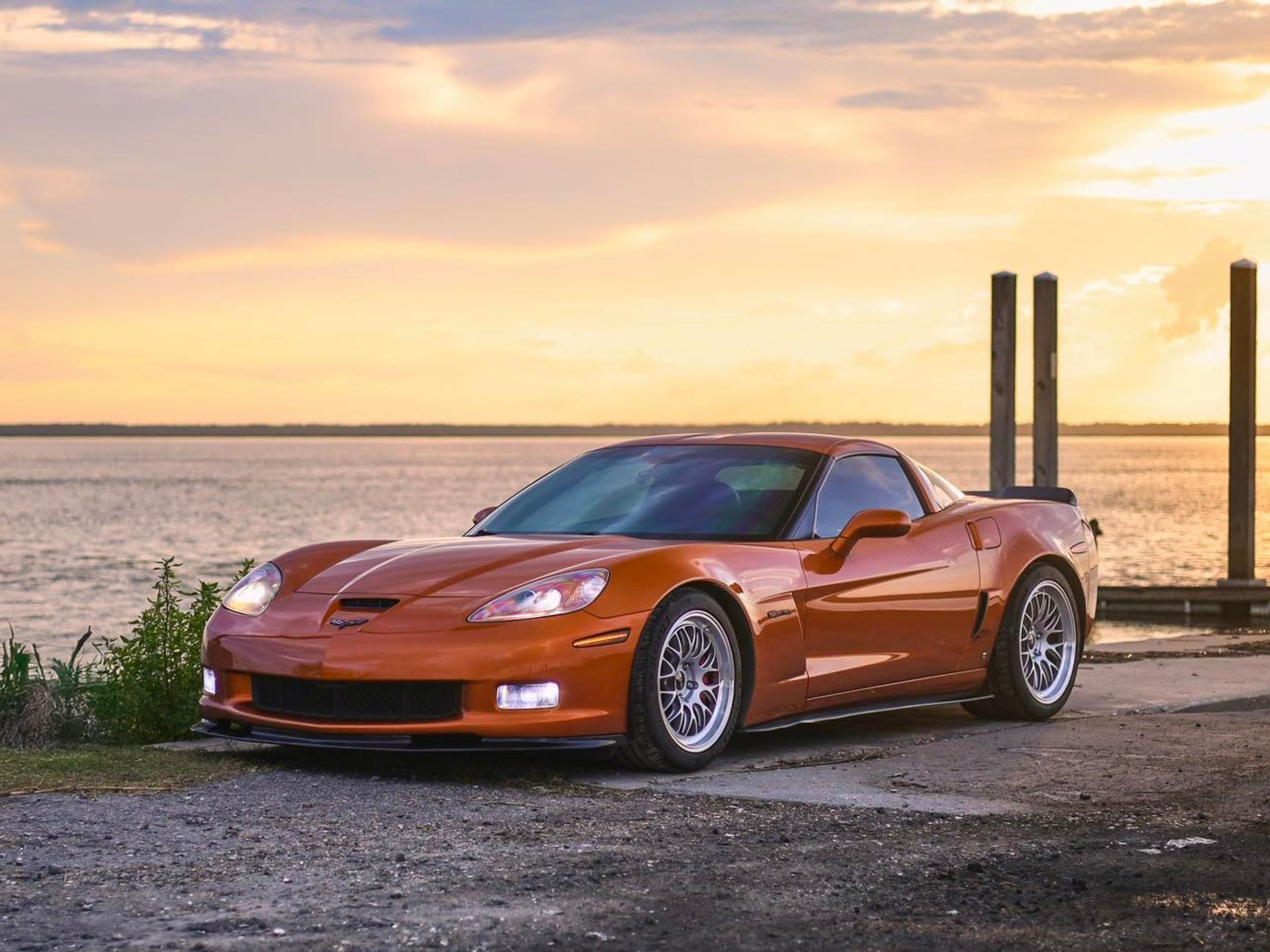 Orange Chevrolet C6 Corvette Z06 with 18"/19" ML-10RT Apex wheels in Machined Lip Race Silver