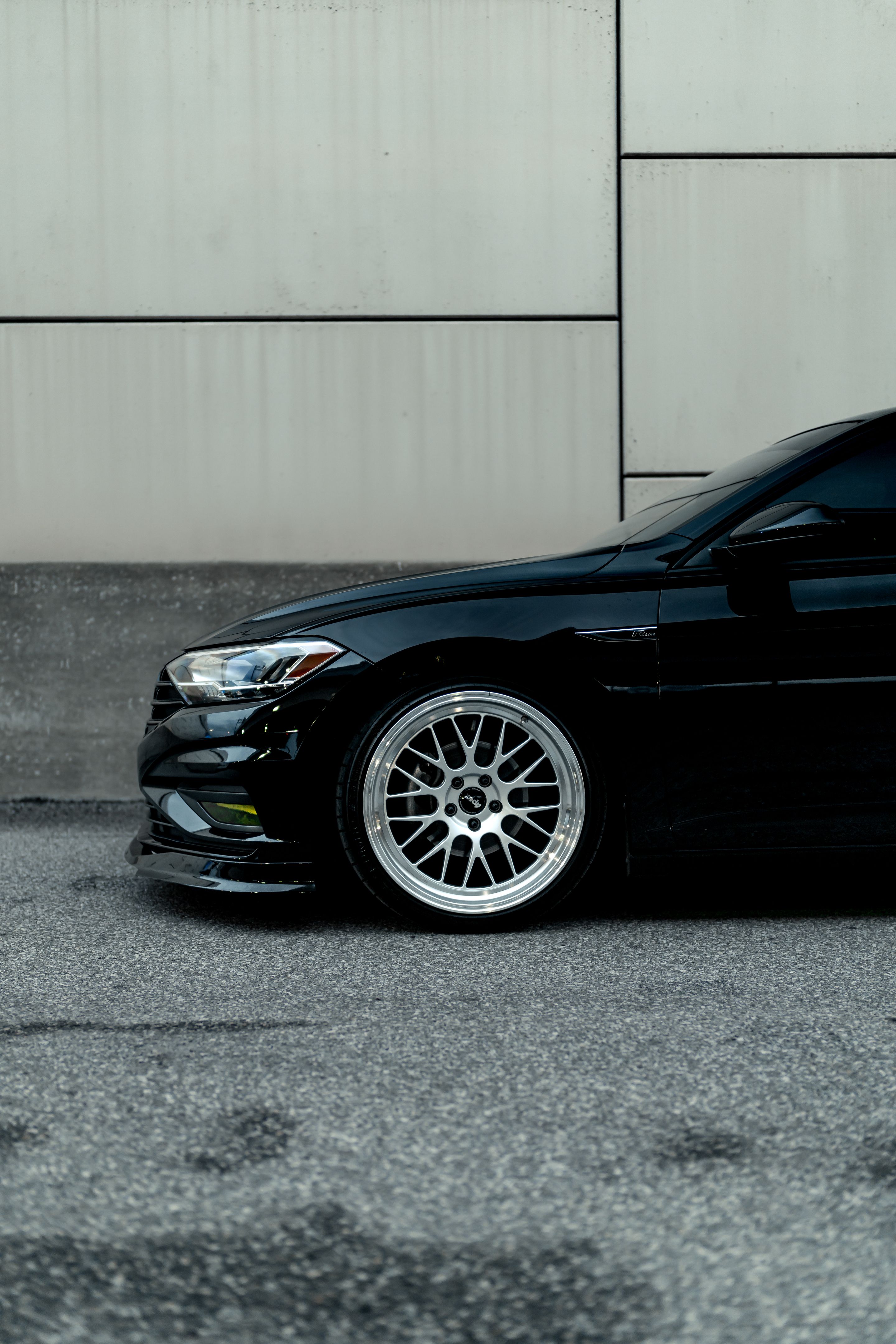 Black VW MK7 Jetta with 19" ML-10RT Apex wheels in Machined Lip Race Silver