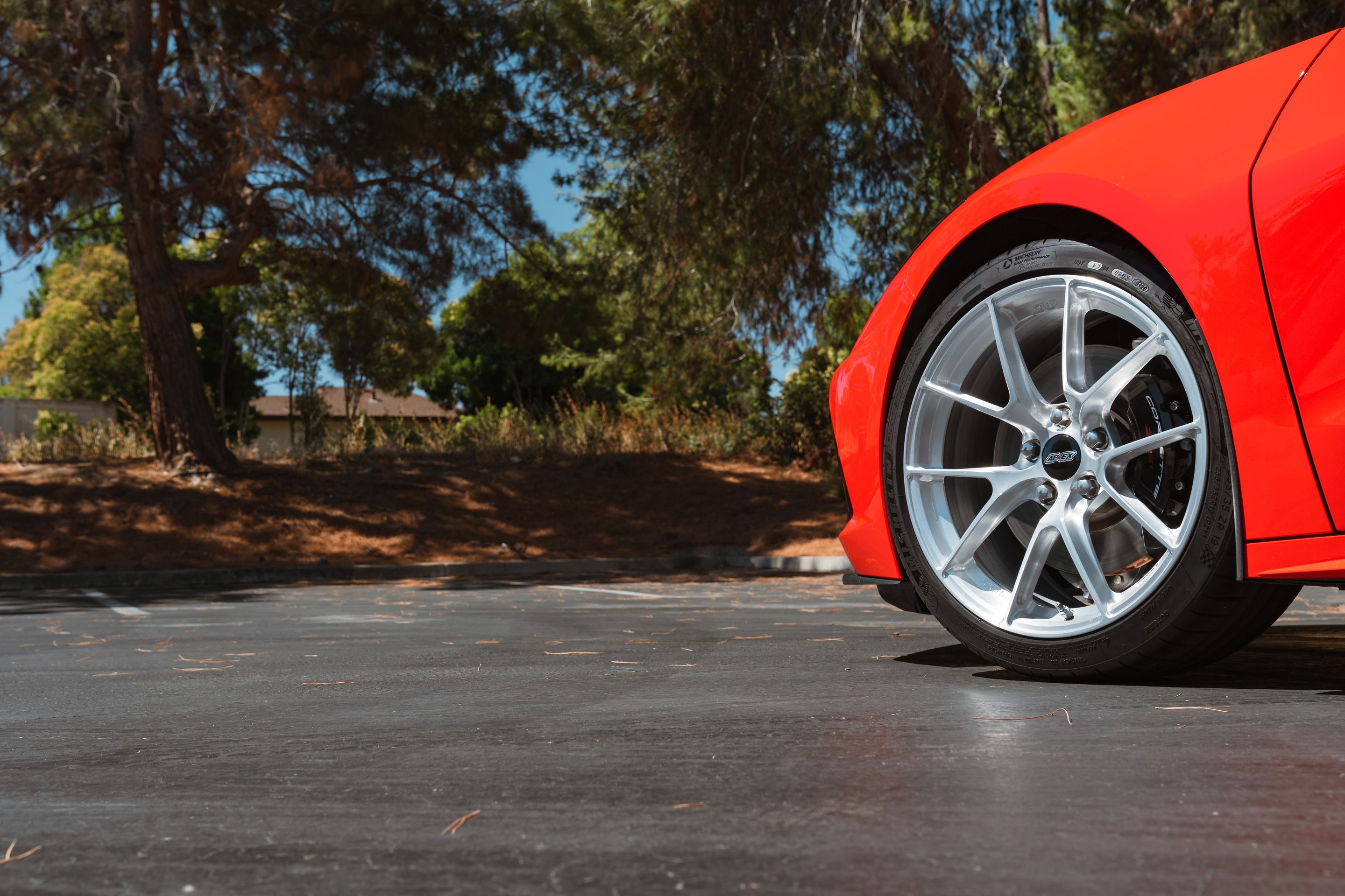 Red Chevrolet C8 Corvette Stingray/Z51 with 19" VS-5RS Apex wheels in Brushed Clear
