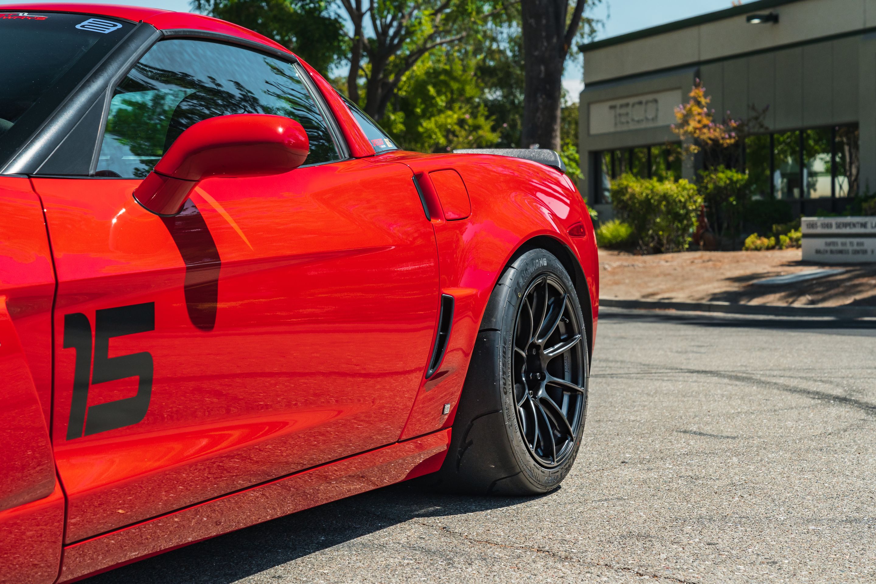 Red Chevrolet C6 Corvette Z06 with 18" SM-10RS Apex wheels in Satin Black