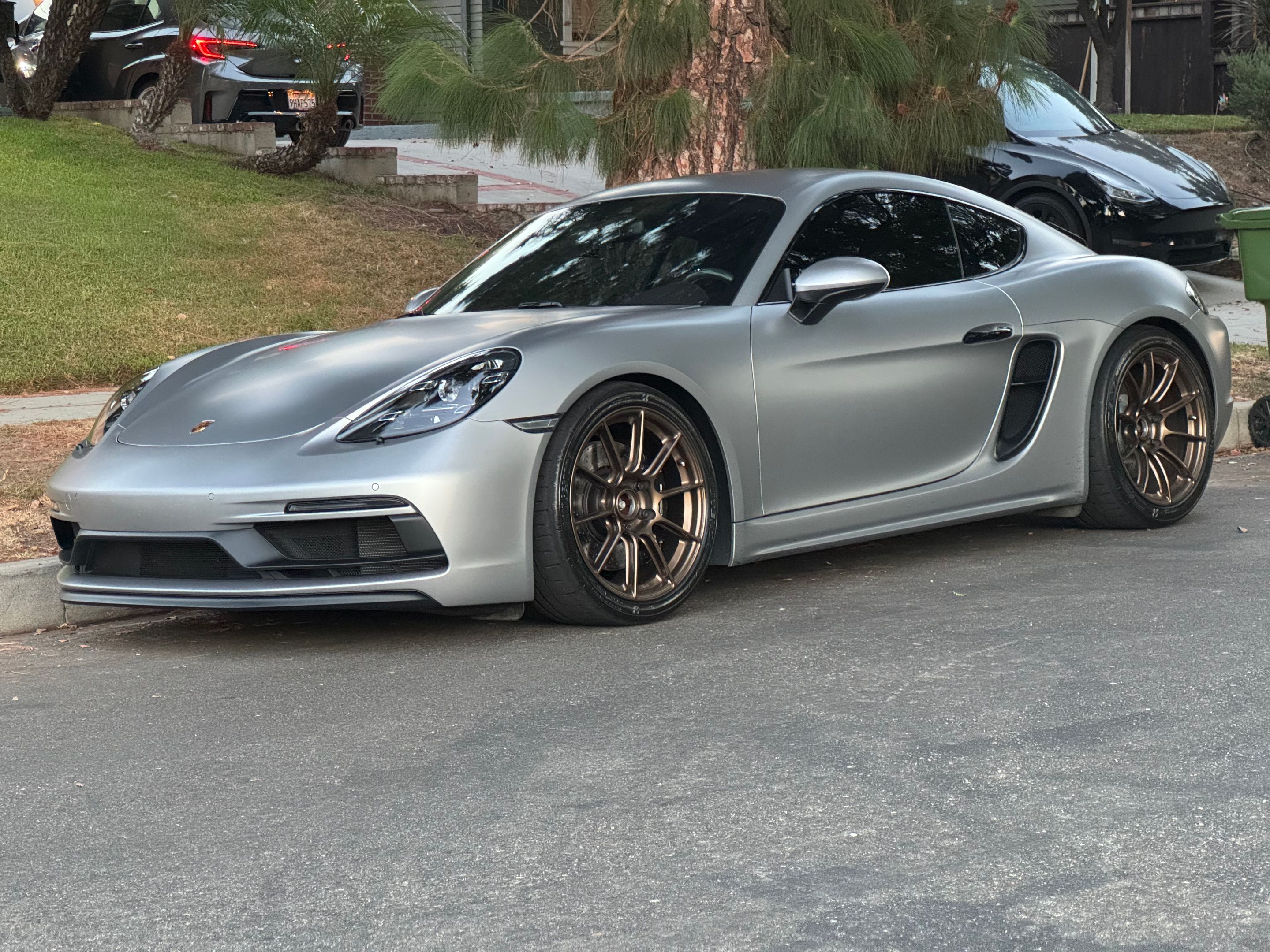Silver Porsche 718 Cayman GTS 4.0L with 19" SM-10RS Apex wheels in Satin Bronze