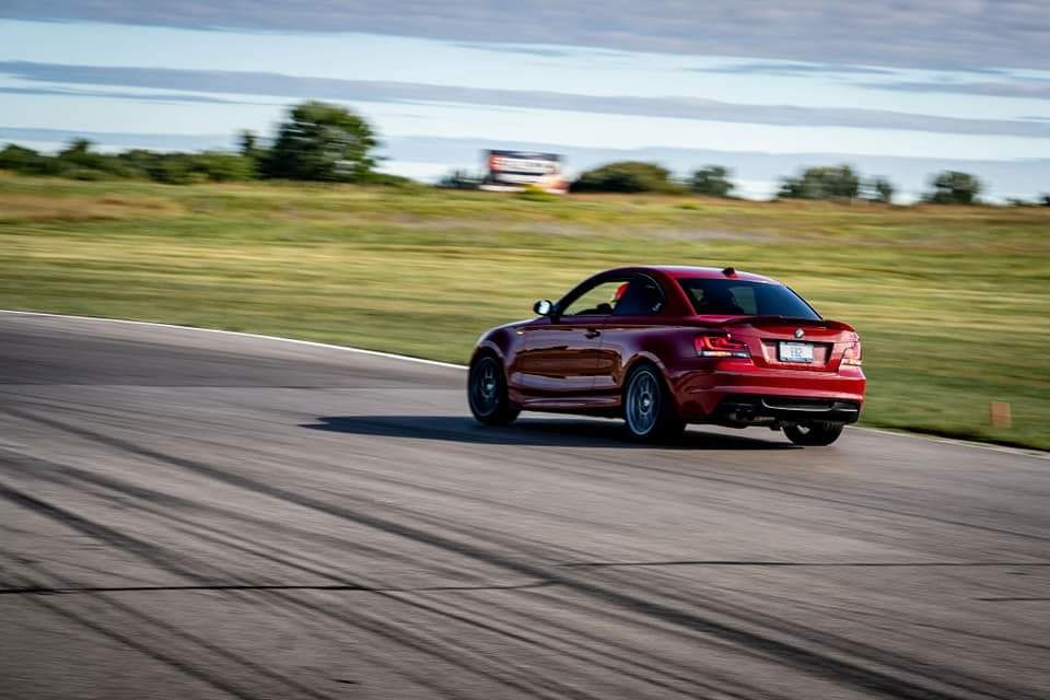 Red BMW E82 Coupe 1 Series with 18" ARC-8 Apex wheels in Hyper Black