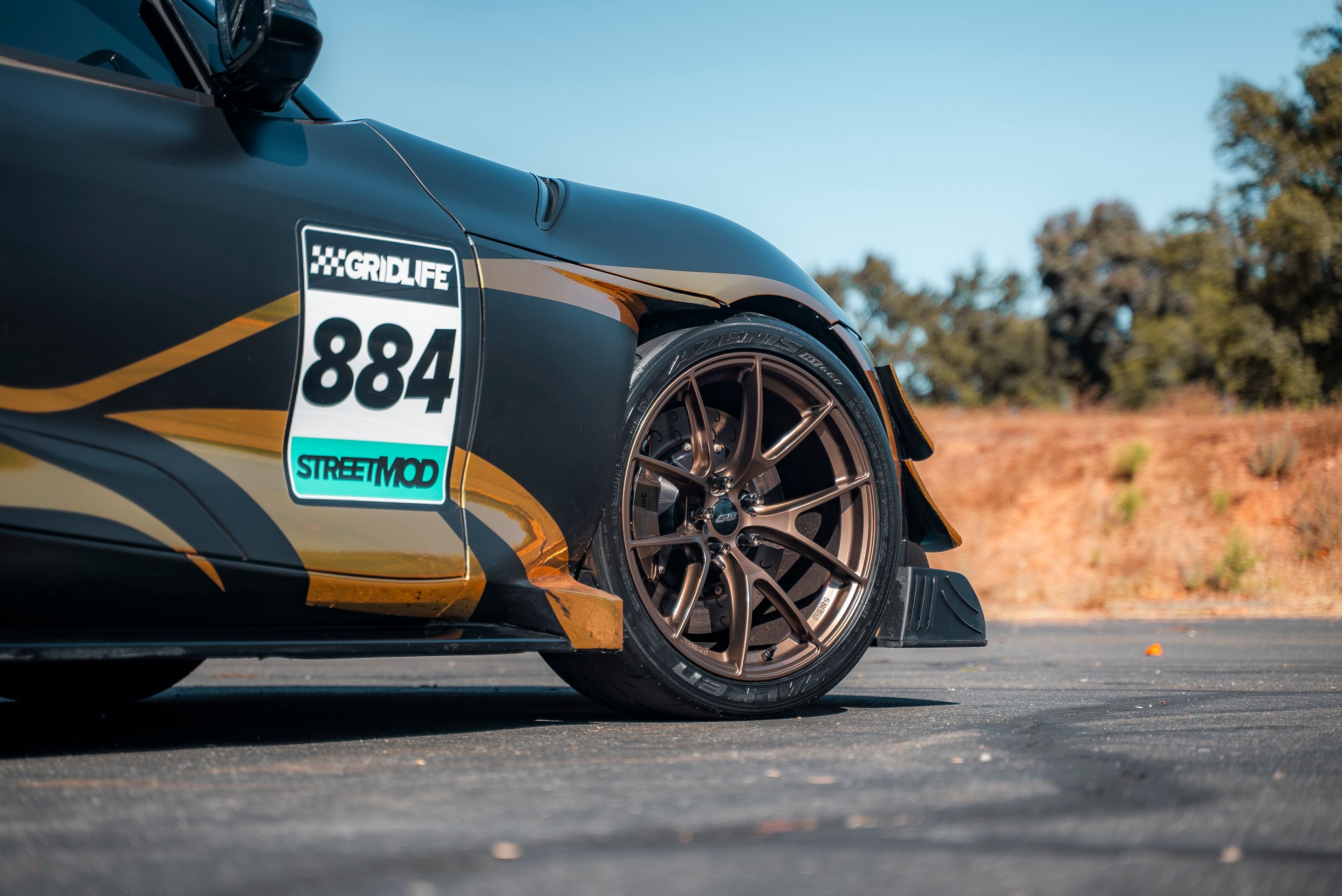 Grey Toyota GR Supra with 19" VS-5RS Apex wheels in Satin Bronze