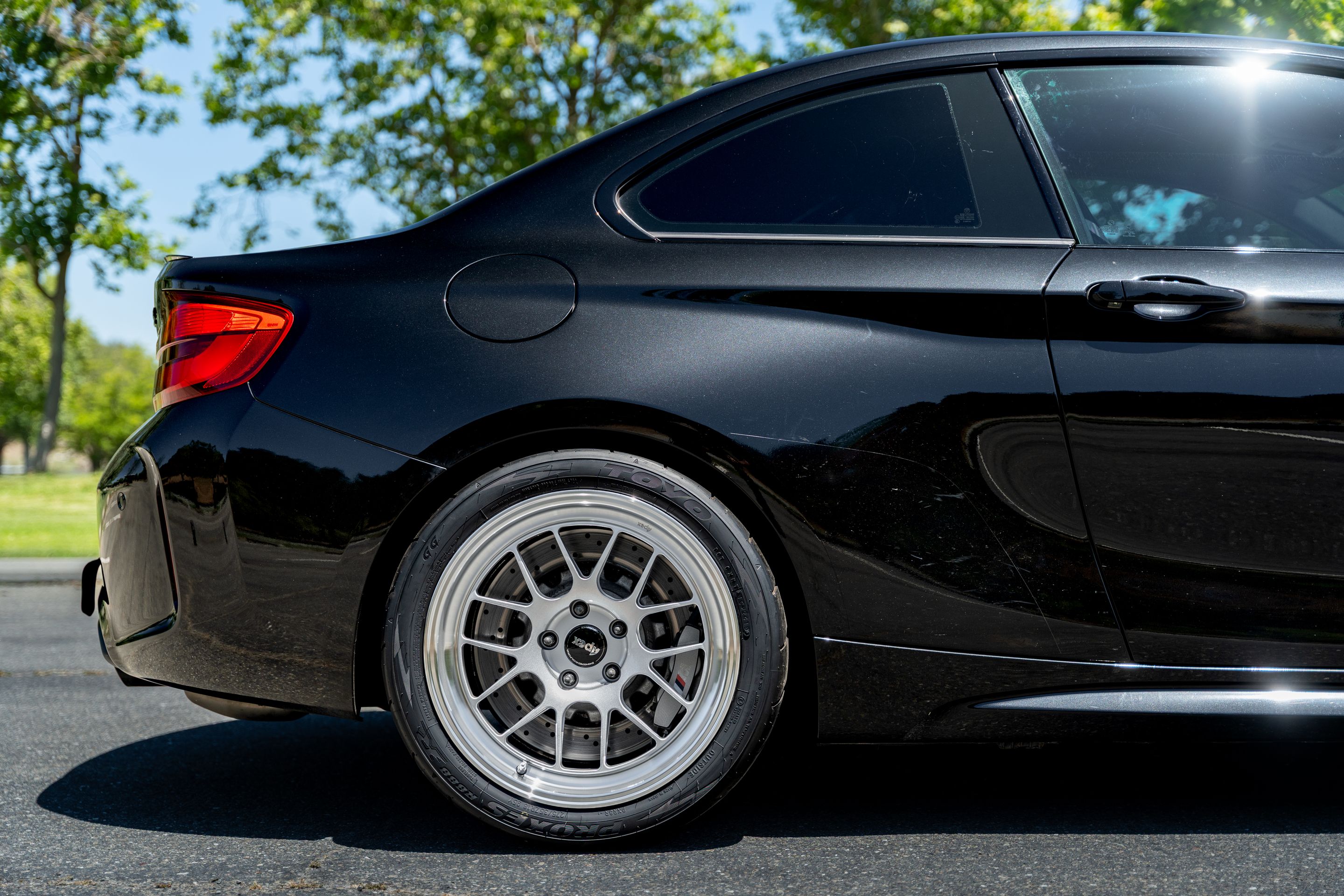Black BMW F87 M2 with 18" ML-7RT Apex wheels in Machined Lip Race Silver