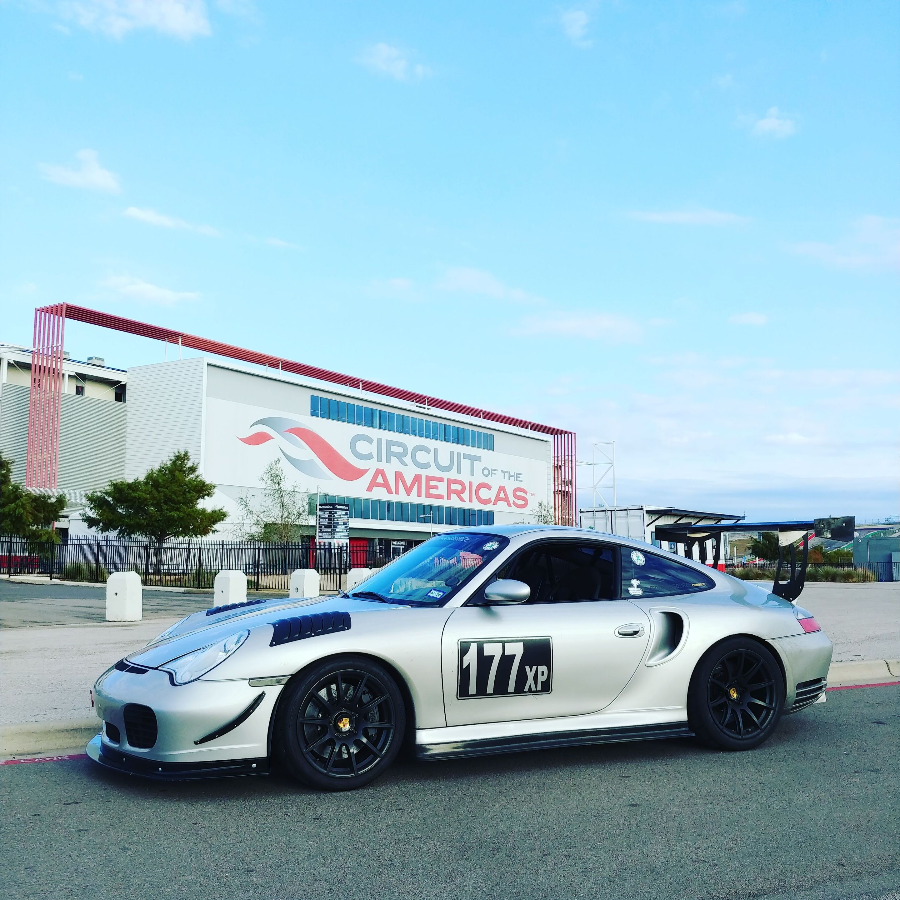 Silver Porsche 911 996 Turbo with 18" SM-10 Apex wheels in Satin Black