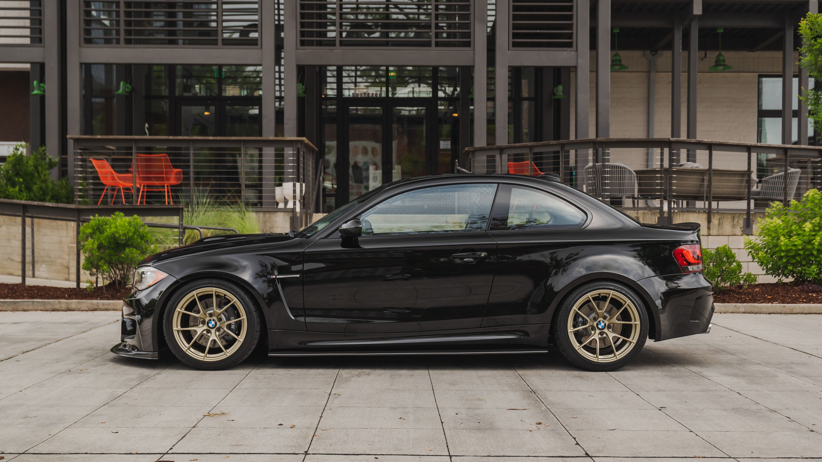 Black BMW E82 Coupe 1 Series with 18" VS-5RS Apex wheels in Motorsport Gold