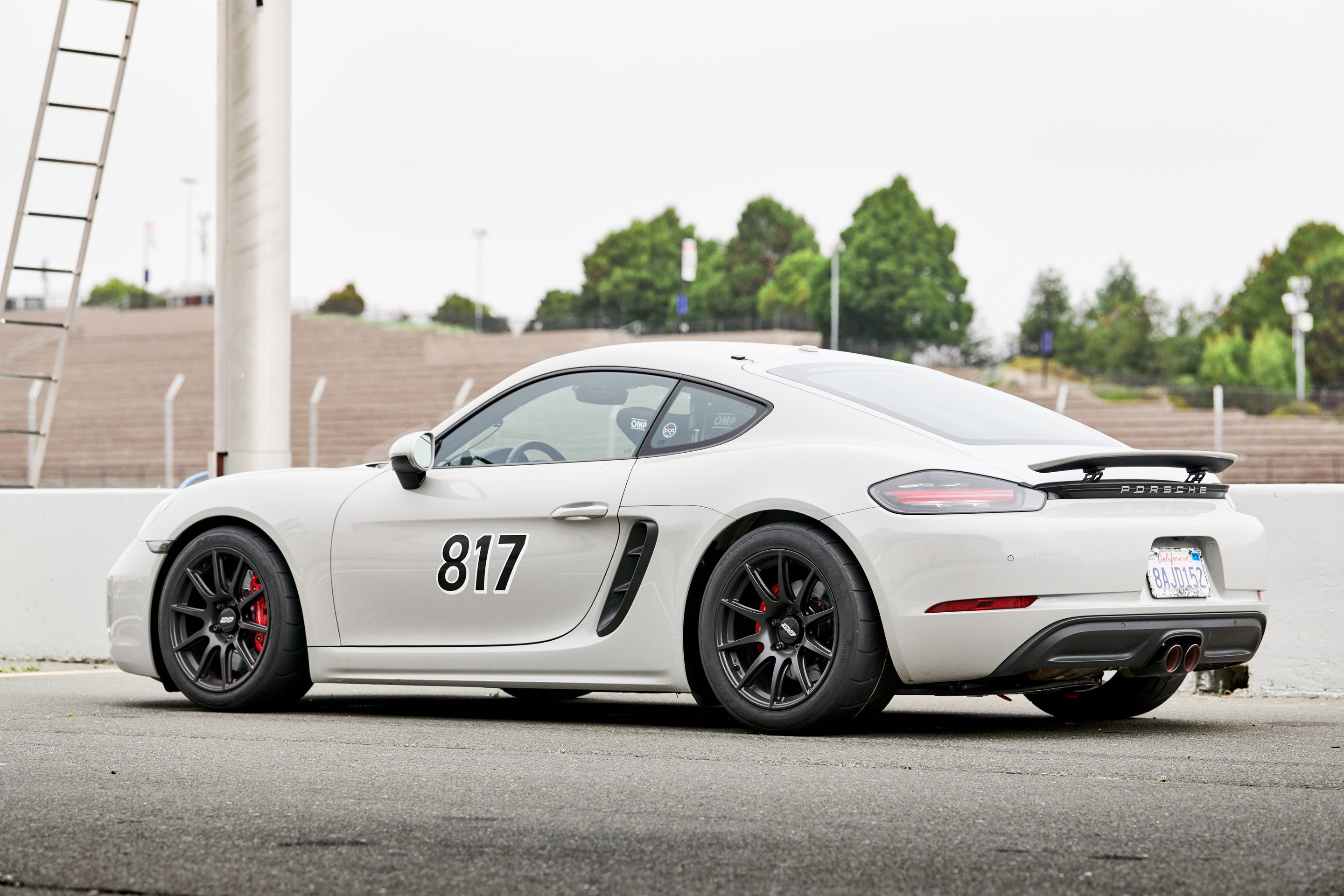 White Porsche 718 Cayman S with 18" SM-10 Apex wheels in Satin Black