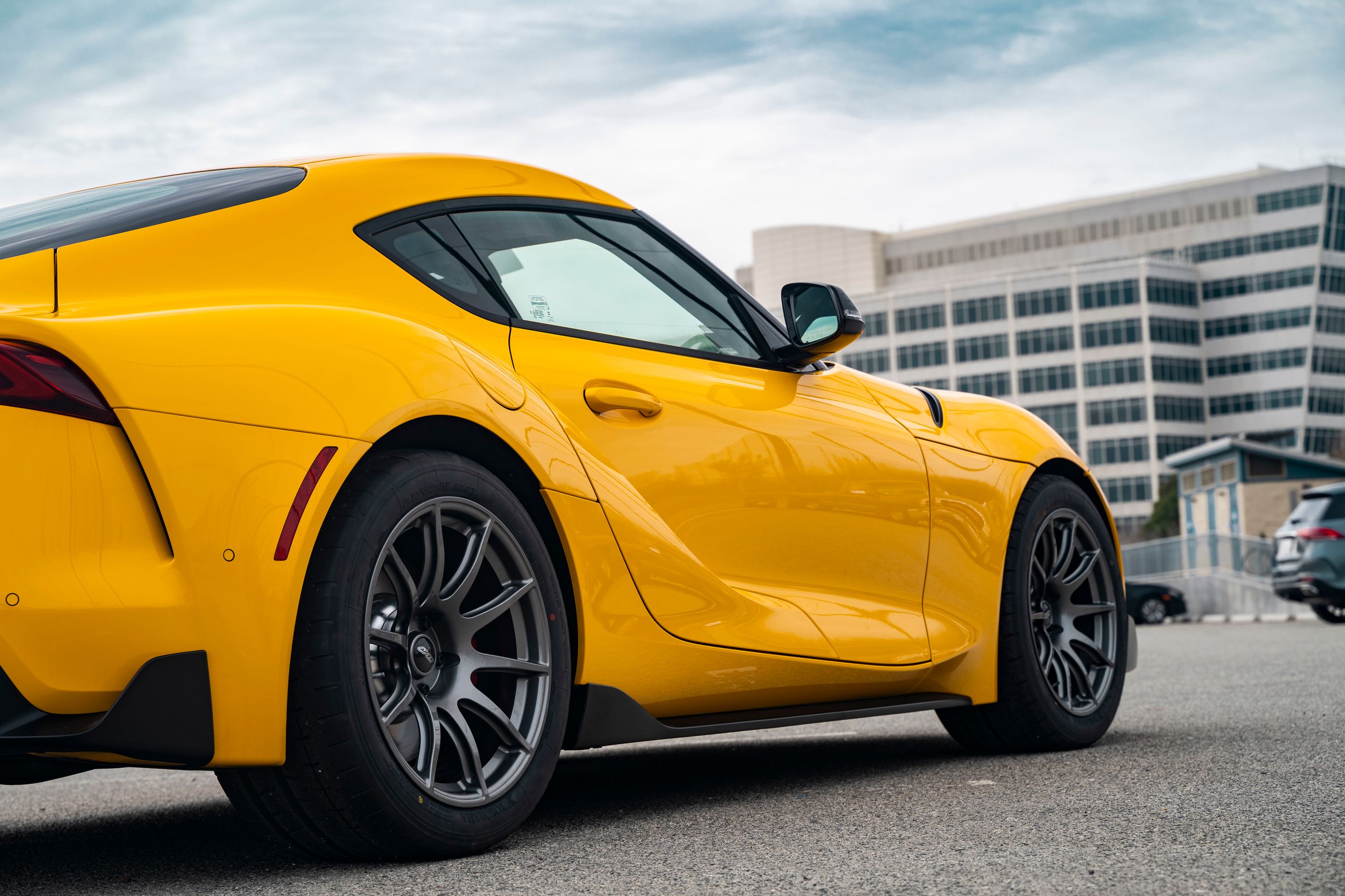 Yellow Toyota GR Supra with 18" SM-10 Apex wheels in Anthracite