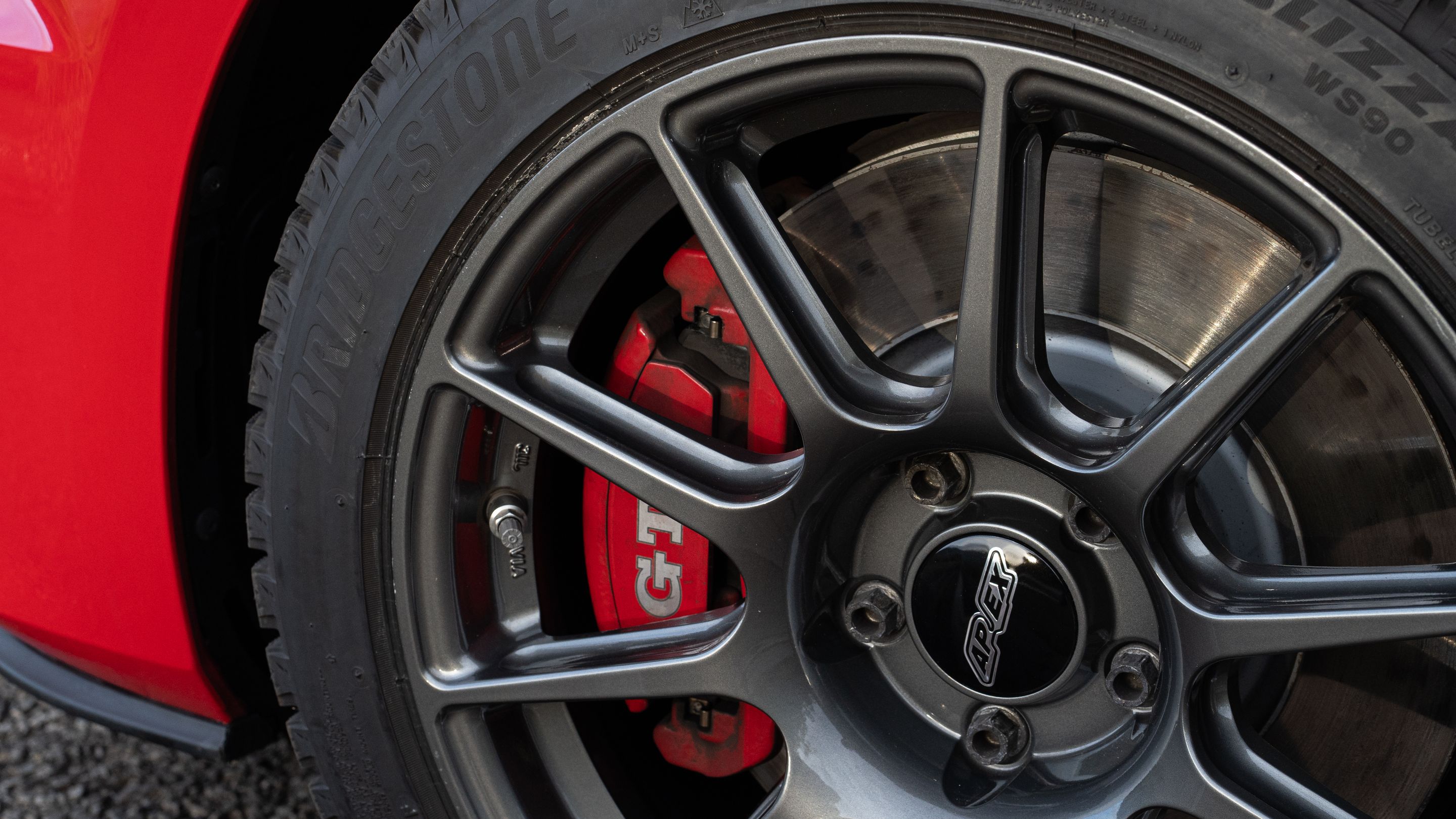 Red VW MK7 GTI with 17" SM-10 Apex wheels in Anthracite