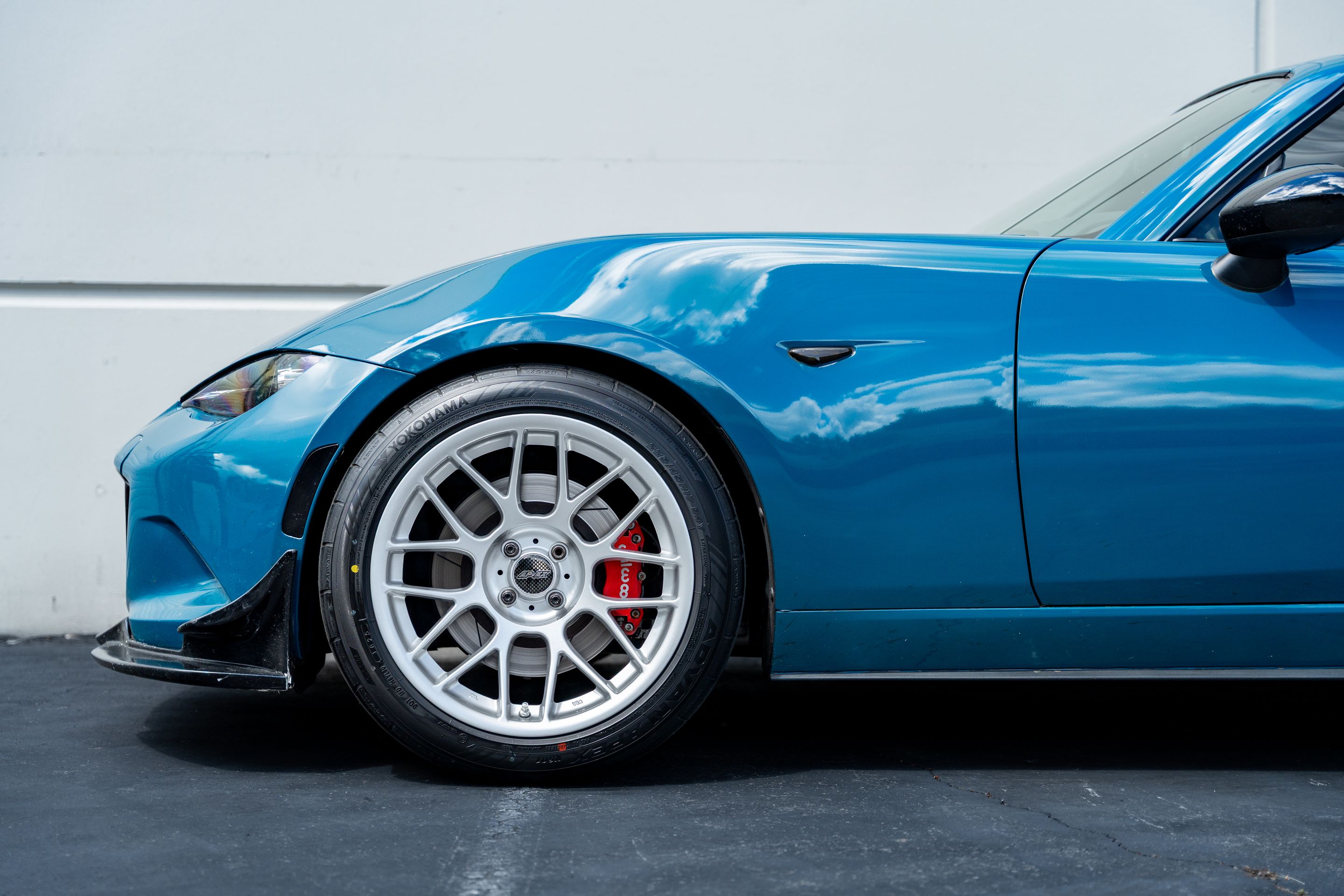 Blue Mazda ND MX-5 Miata with 17" ARC-8 Apex wheels in Race Silver