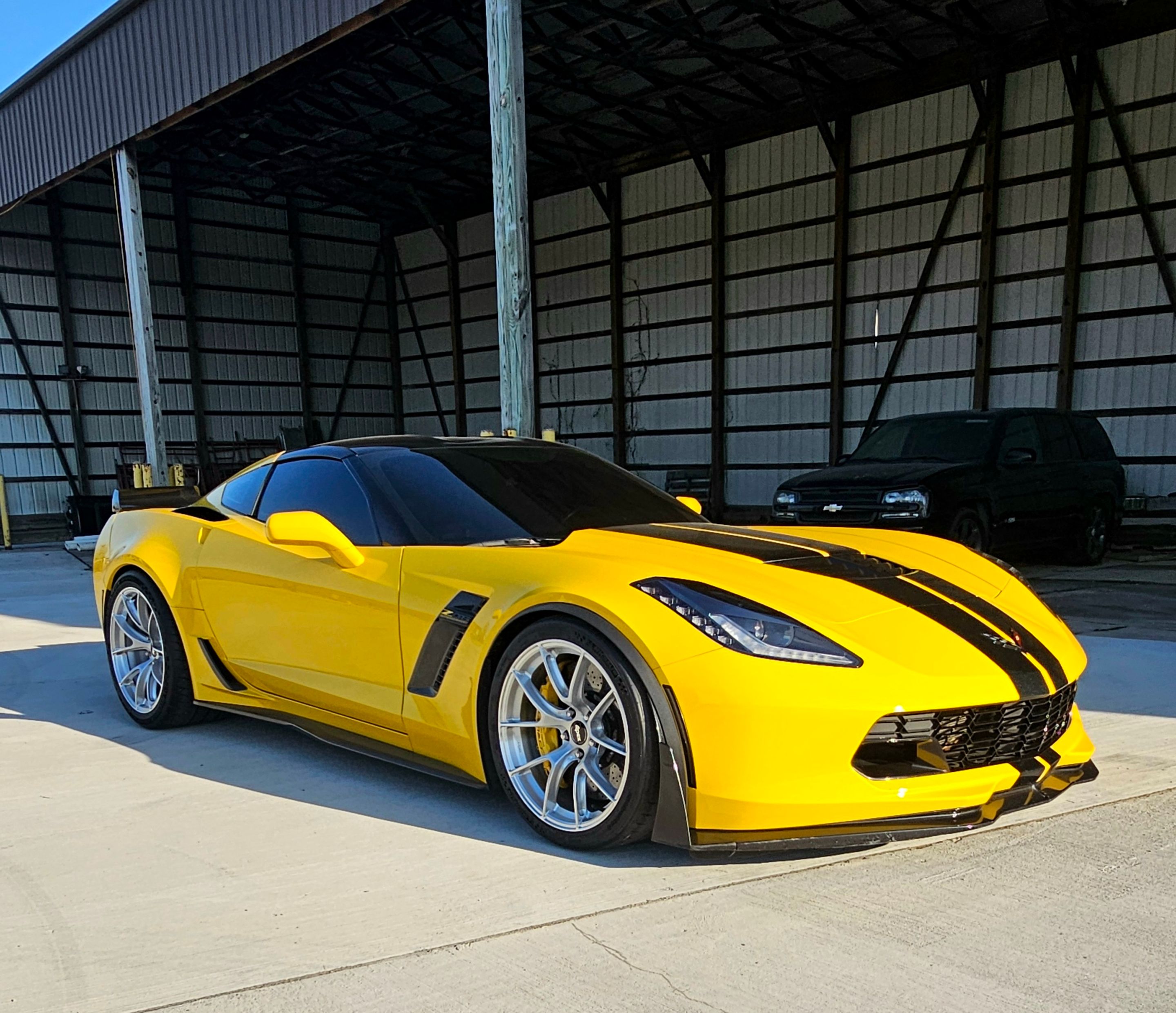 Yellow Chevrolet C7 Corvette Z06 with 19"/20" VS-5RS Apex wheels in Brushed Clear