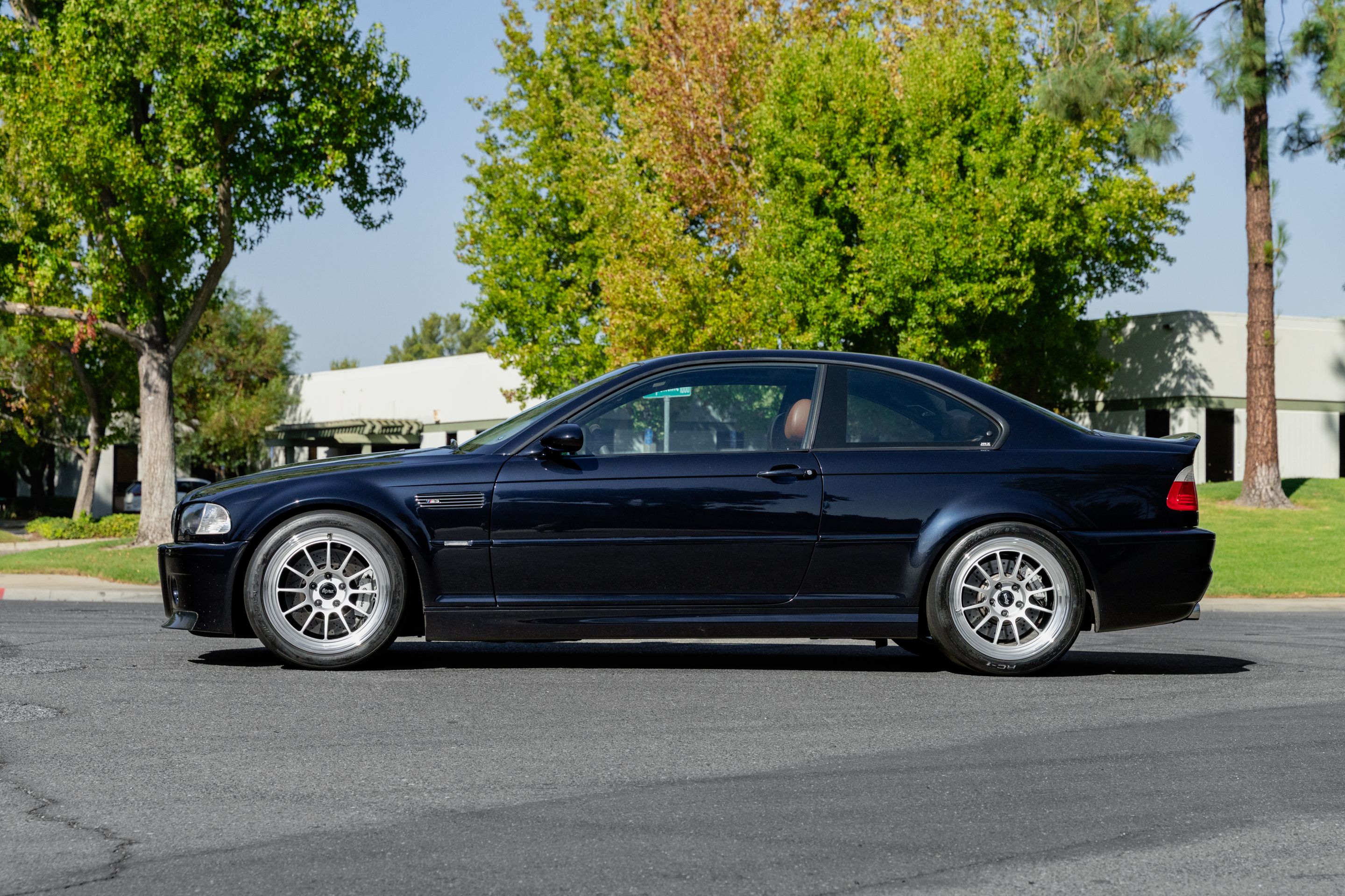 Black BMW E46 M3 with 18" SL-12 Apex wheels in Machined Lip Race Silver