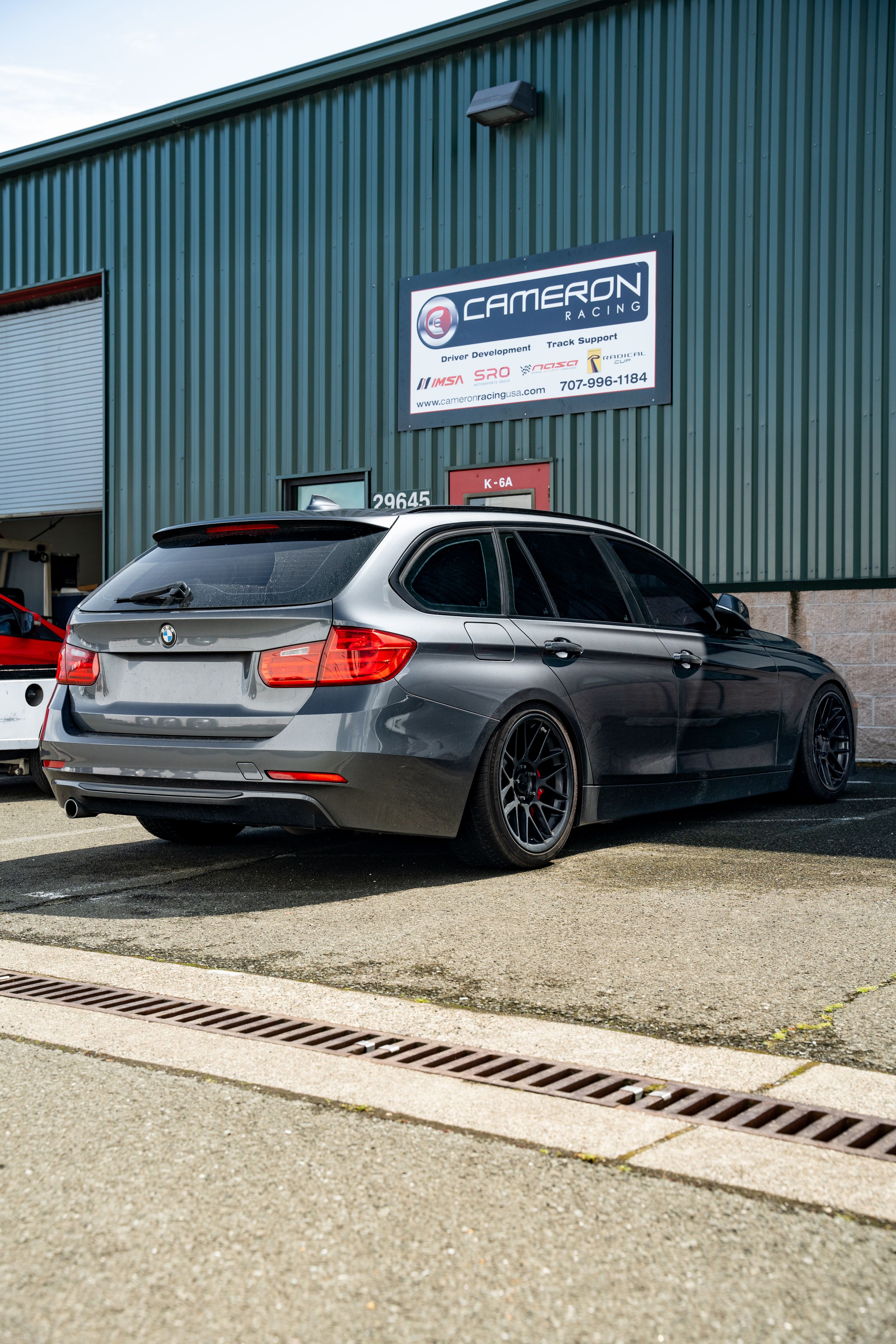 Grey BMW F31 Wagon 3 Series with 18" ARC-8 Apex wheels in Satin Black