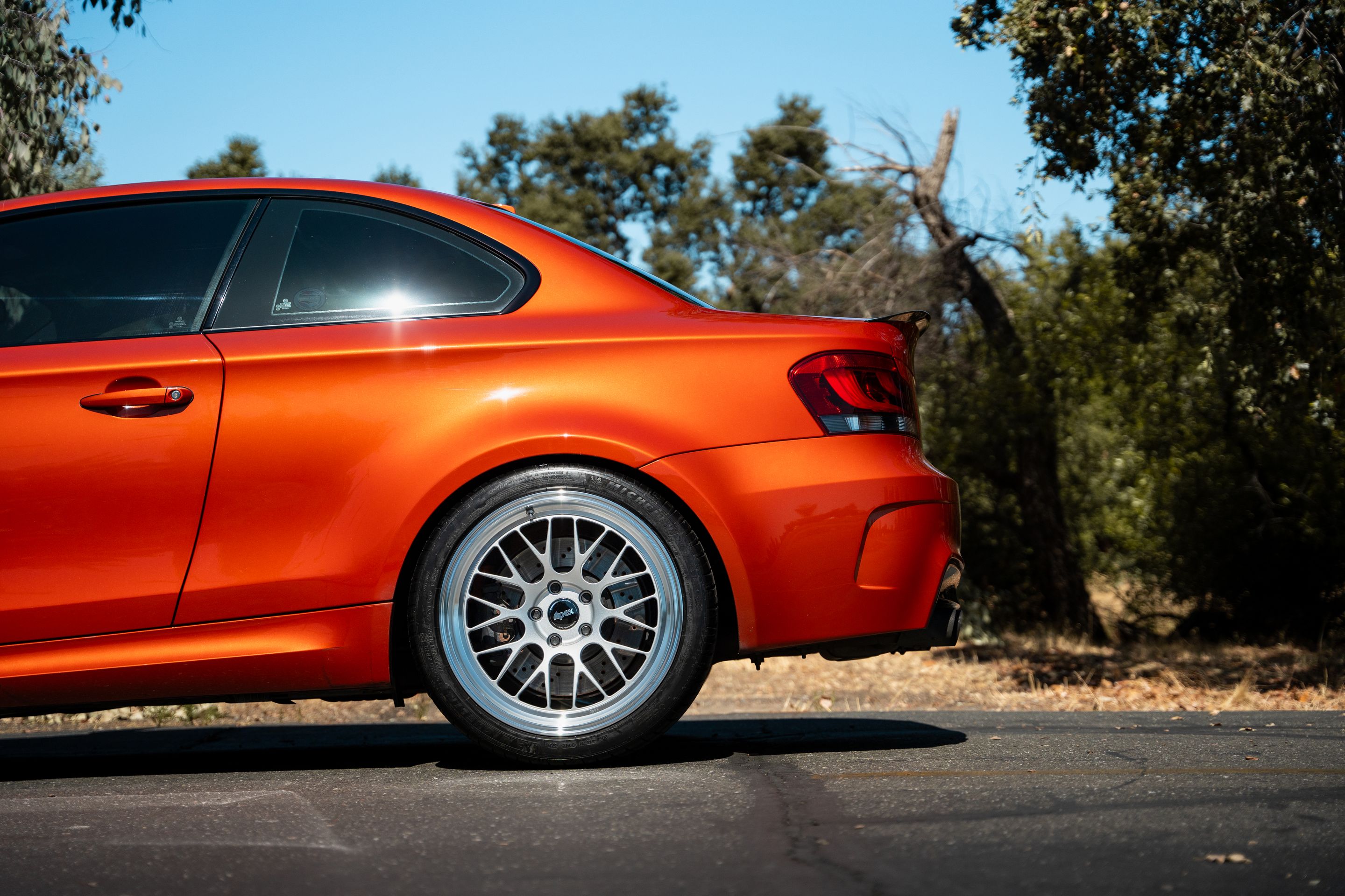 Orange BMW E82 1M with 19" ML-10RT Apex wheels in Machined Lip Race Silver