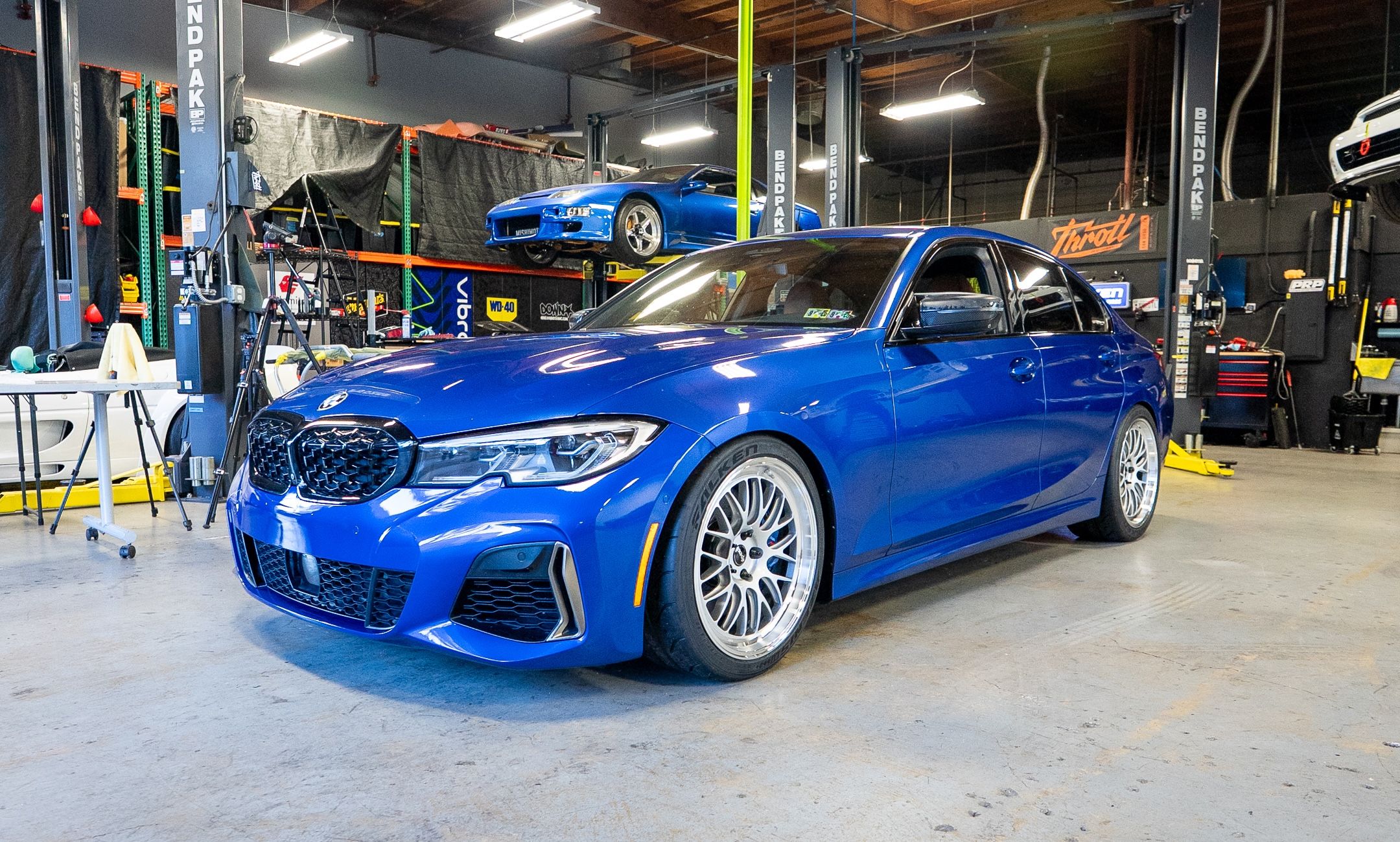 Blue BMW G20 Sedan 3 Series with 19" ML-10RT Apex wheels in Machined Lip Race Silver