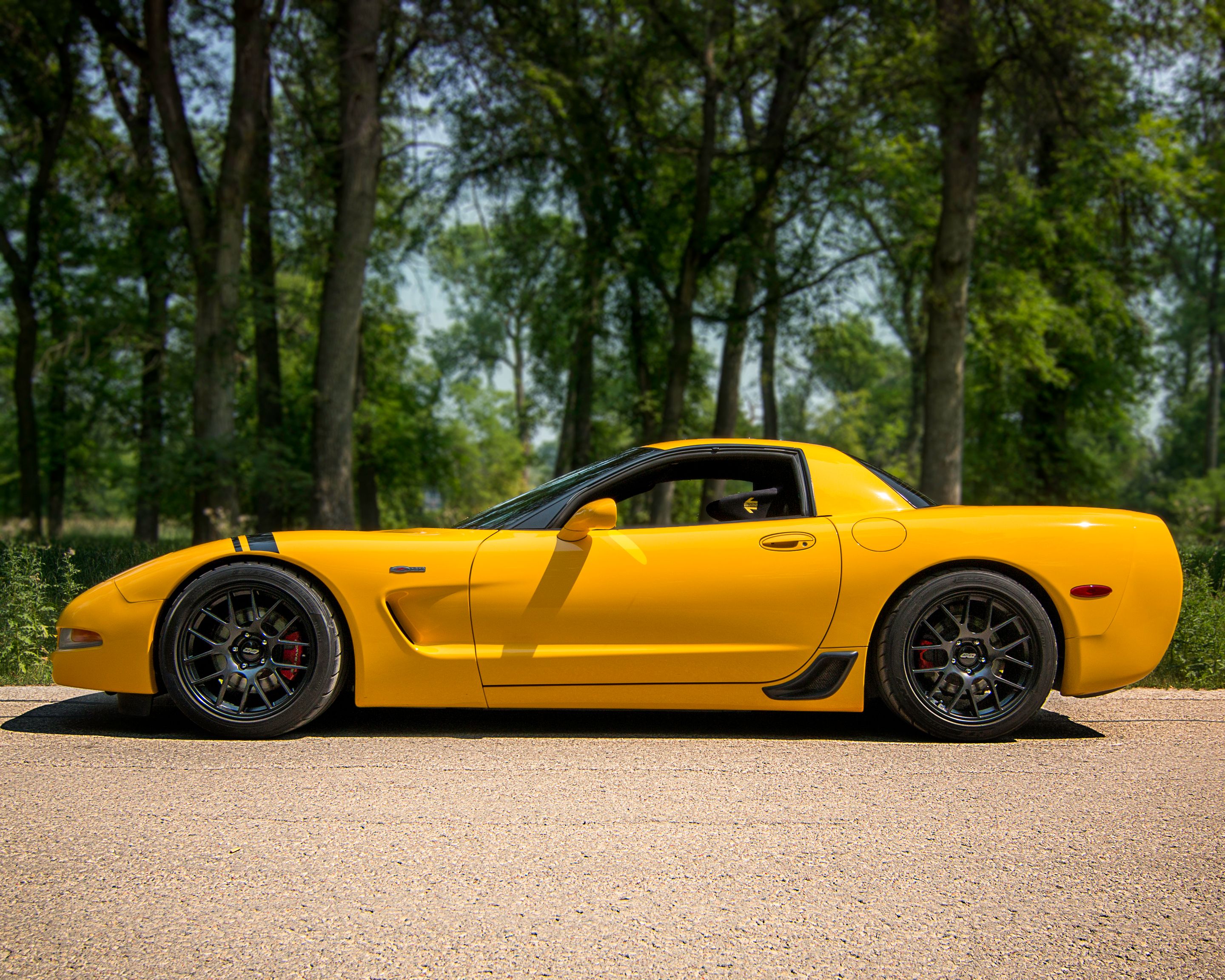 Yellow Chevrolet C5 Corvette Z06 with 18" EC-7 Apex wheels in Satin Black